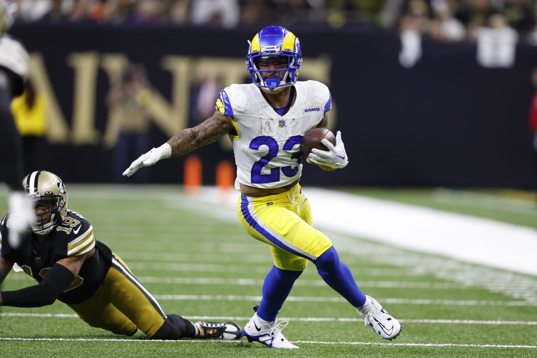 Los Angeles Rams running back Kyren Williams (23) carries the ball against the New Orleans Saints in the first half of an NFL football game in New Orleans, Sunday, Nov. 20, 2022. (AP Photo/Butch Dill)