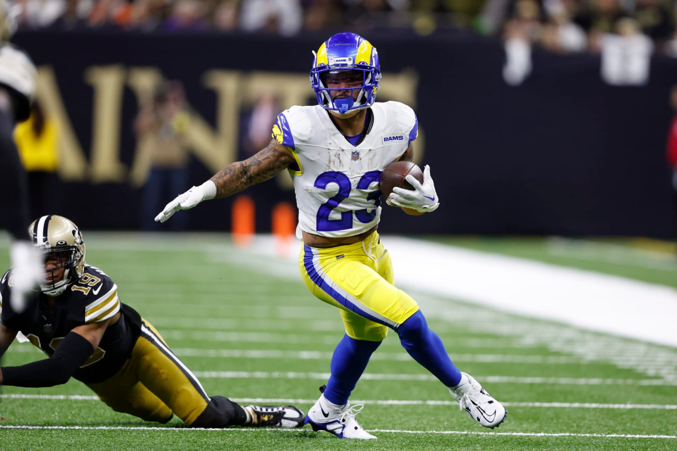 Los Angeles Rams running back Kyren Williams (23) carries the ball against the New Orleans Saints in the first half of an NFL football game in New Orleans, Sunday, Nov. 20, 2022. (AP Photo/Butch Dill)
