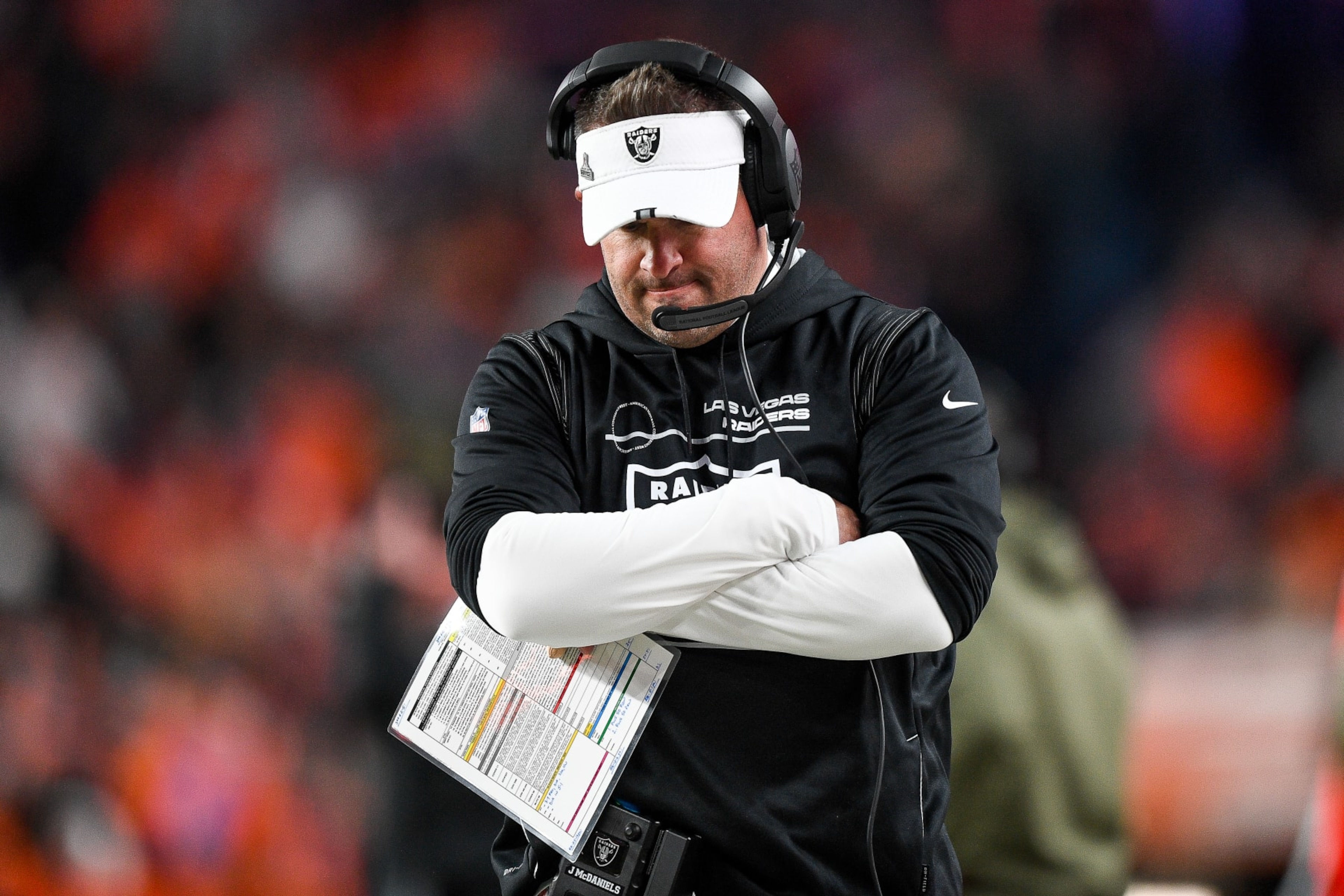 DENVER, COLORADO - NOVEMBER 20: Head coach Josh McDaniels of the Las Vegas Raiders looks on during a game against the Denver Broncos at Empower Field At Mile High on November 20, 2022 in Denver, Colorado. (Photo by Dustin Bradford/Getty Images) DENVER, COLORADO - NOVEMBER 20: Head coach Josh McDaniels of the Las Vegas Raiders looks on during a game against the Denver Broncos at Empower Field At Mile High on November 20, 2022 in Denver, Colorado. (Photo by Dustin Bradford/Getty Images)