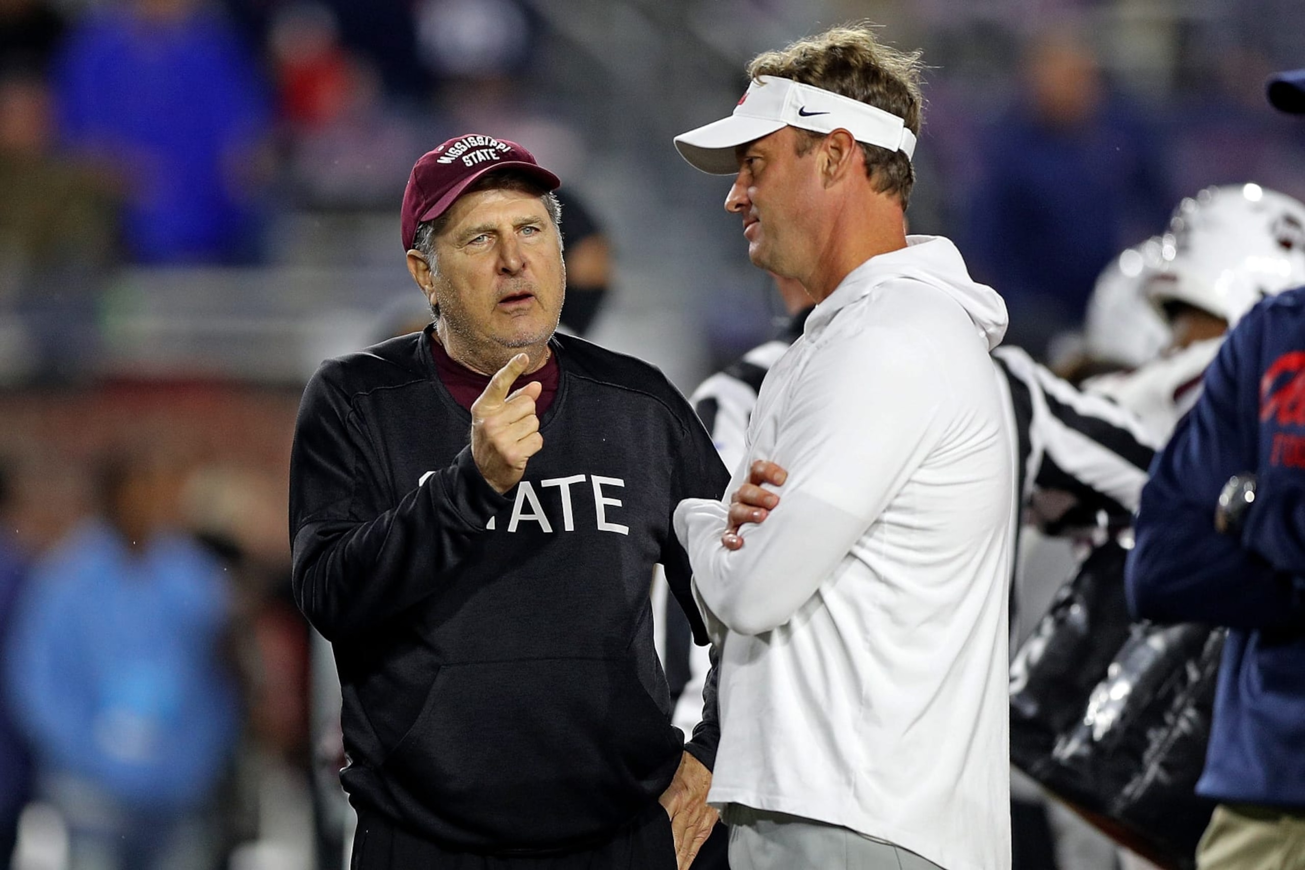 OXFORD, MISSISSIPPI - NOVEMBER 24: Head coach Mike Leach of the Mississippi State Bulldogs and head coach Lane Kiffin of the Mississippi Rebels talk before the game at Vaught-Hemingway Stadium on November 24, 2022 in Oxford, Mississippi. (Photo by Justin Ford/Getty Images) OXFORD, MISSISSIPPI - NOVEMBER 24: Head coach Mike Leach of the Mississippi State Bulldogs and head coach Lane Kiffin of the Mississippi Rebels talk before the game at Vaught-Hemingway Stadium on November 24, 2022 in Oxford, Mississippi. (Photo by Justin Ford/Getty Images)