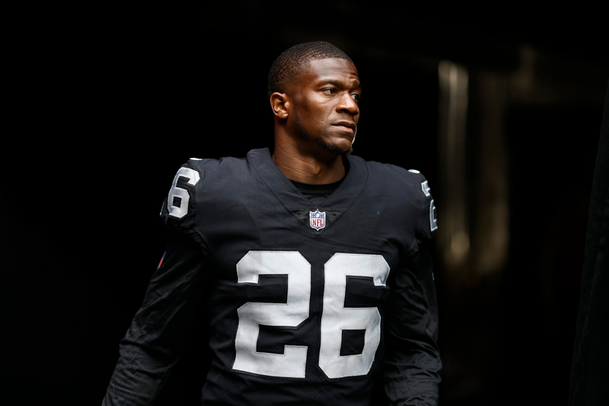 LAS VEGAS, NEVADA - SEPTEMBER 18: Rock Ya-Sin #26 of the Las Vegas Raiders walks through the tunnel to the field prior to an NFL football game between the Las Vegas Raiders and the Arizona Cardinals at Allegiant Stadium on September 18, 2022 in Las Vegas, Nevada. (Photo by Michael Owens/Getty Images) LAS VEGAS, NEVADA - SEPTEMBER 18: Rock Ya-Sin #26 of the Las Vegas Raiders walks through the tunnel to the field prior to an NFL football game between the Las Vegas Raiders and the Arizona Cardinals at Allegiant Stadium on September 18, 2022 in Las Vegas, Nevada. (Photo by Michael Owens/Getty Images)