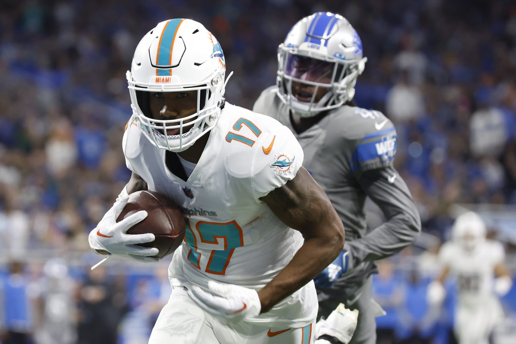 DETROIT, MICHIGAN - OCTOBER 30: Jaylen Waddle #17 of the Miami Dolphins catches a pass for a touchdown against AJ Parker #41 of the Detroit Lions at Ford Field on October 30, 2022 in Detroit, Michigan. (Photo by Leon Halip/Getty Images)