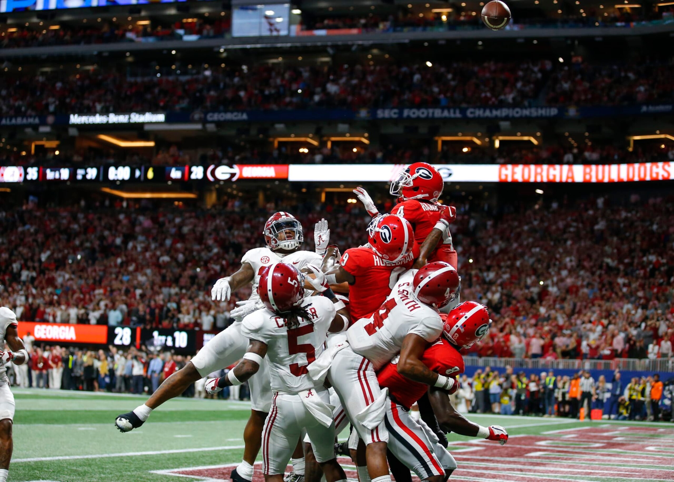 ATLANTA, GA - DECEMBER 01: The pass flies over the heads in the end zone for the final play of the SEC Championship game of the Georgia Bulldogs v Alabama Crimson Tide at Mercedes-Benz Stadium in Atlanta, GA. (Photo by Todd Kirkland/Icon Sportswire via Getty Images)