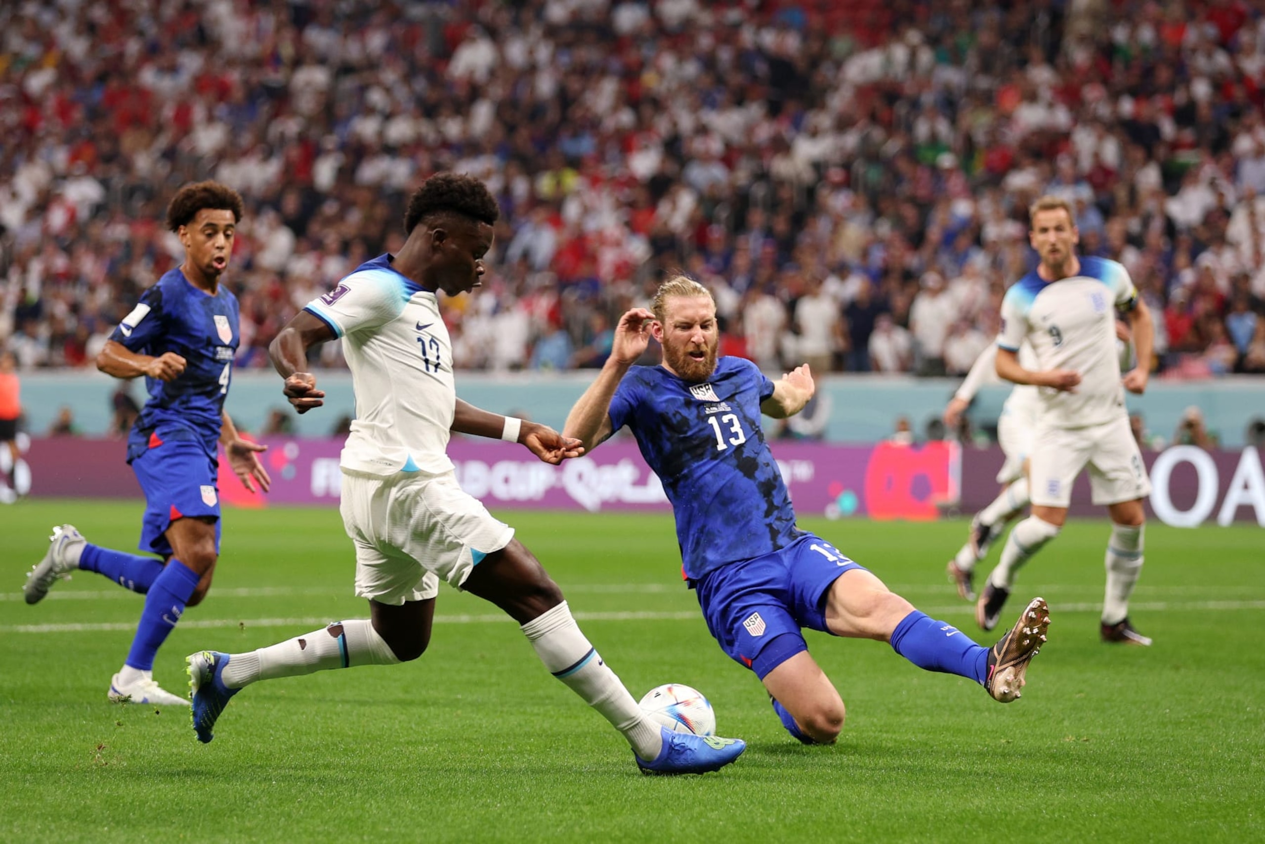 Tim Ream of United States defends Bukayo Saka of England. Tim Ream of United States defends Bukayo Saka of England.