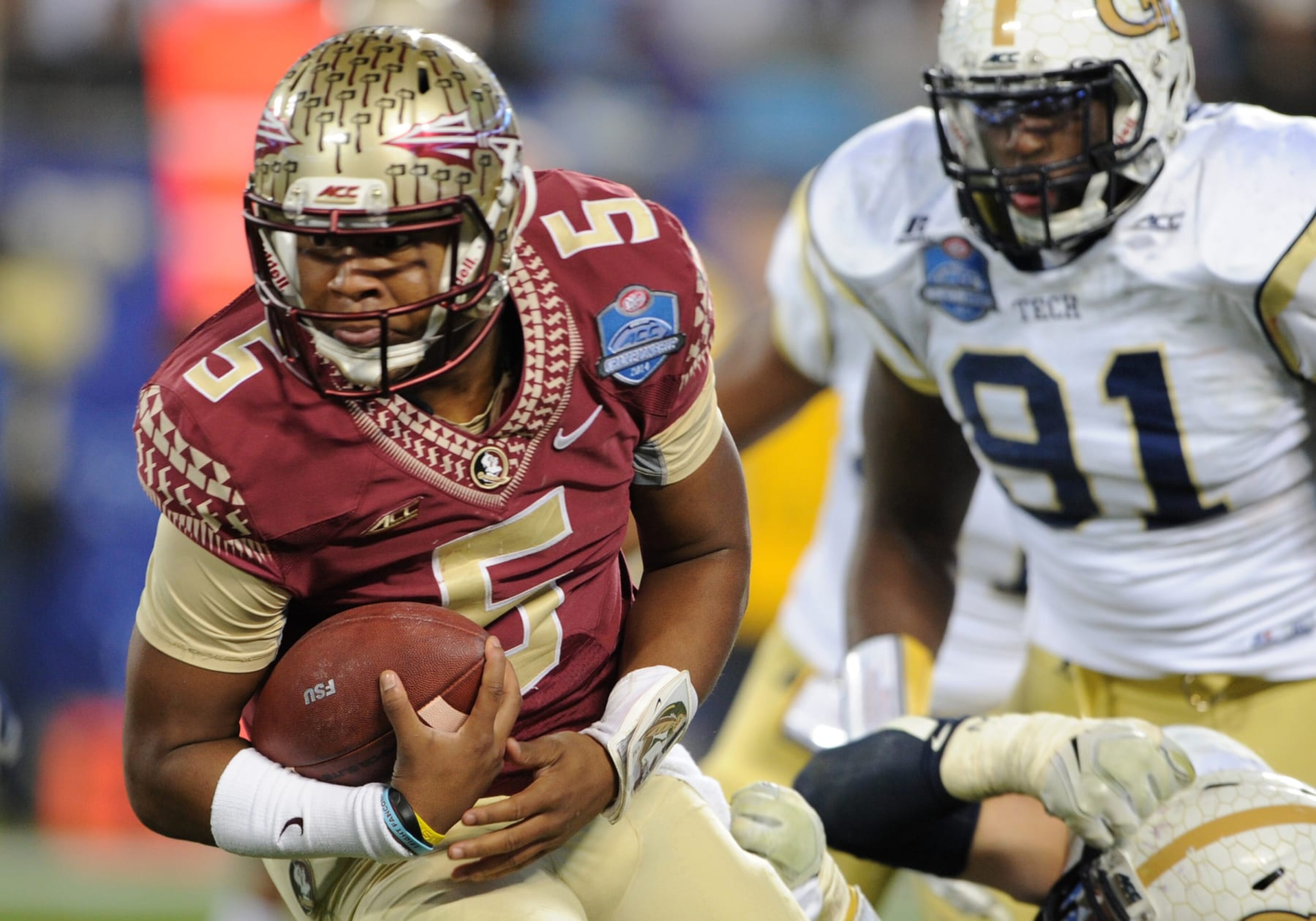 December 06 2014: Florida State Seminoles quarterback Jameis Winston (5) tries to spin out of a tackle during the ACC Championship game at Bank of America in Charlotte,NC. (Photo by Dannie Walls/Icon Sportswire/Corbis/Icon Sportswire via Getty Images)