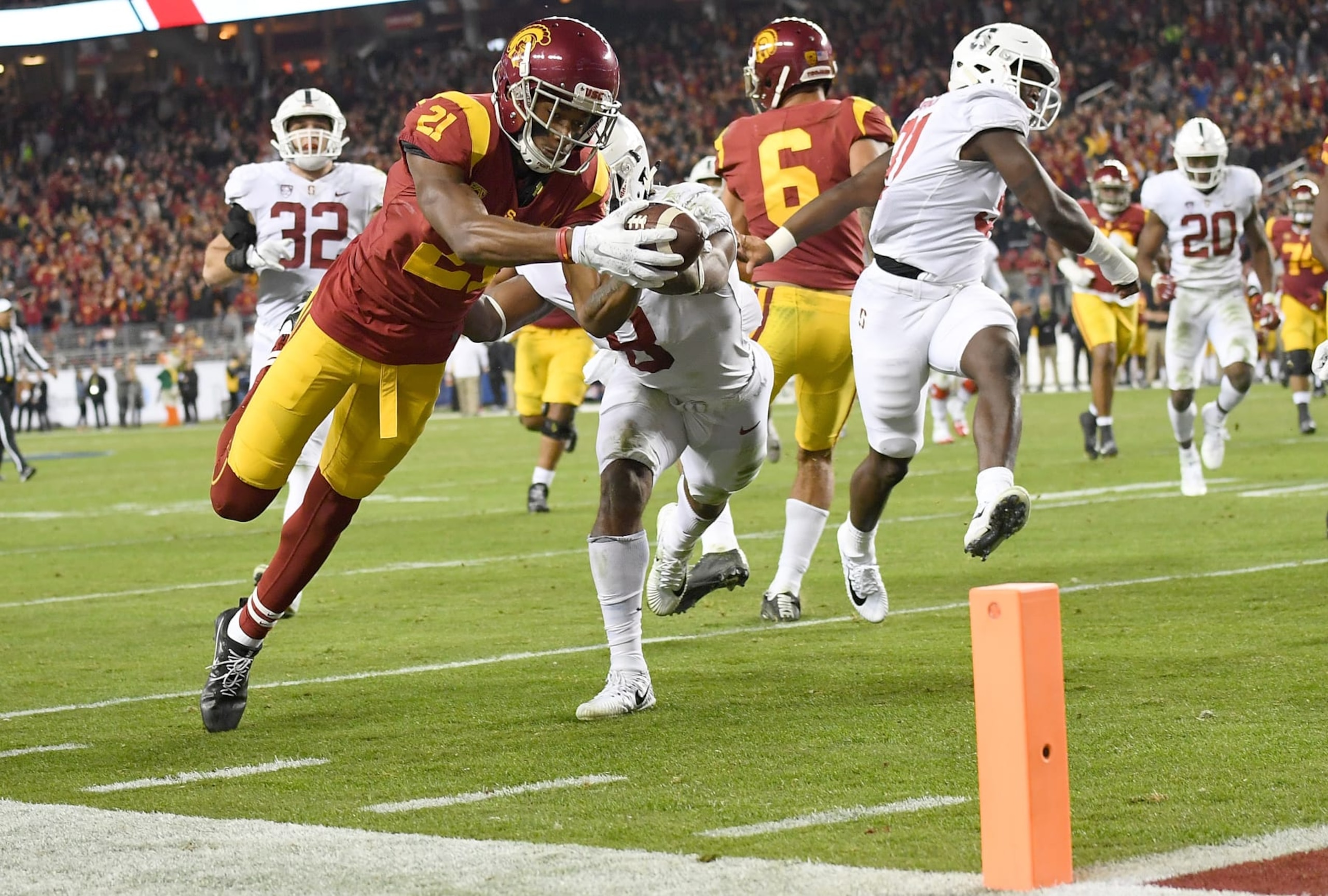 SANTA CLARA, CA - DECEMBER 01:  Tyler Vaughns #21 of the USC Trojans dives into the endzone for a touchdown against the Stanford Cardinal during the Pac-12 Football Championship Game at Levi's Stadium on December 1, 2017 in Santa Clara, California.  (Photo by Thearon W. Henderson/Getty Images)