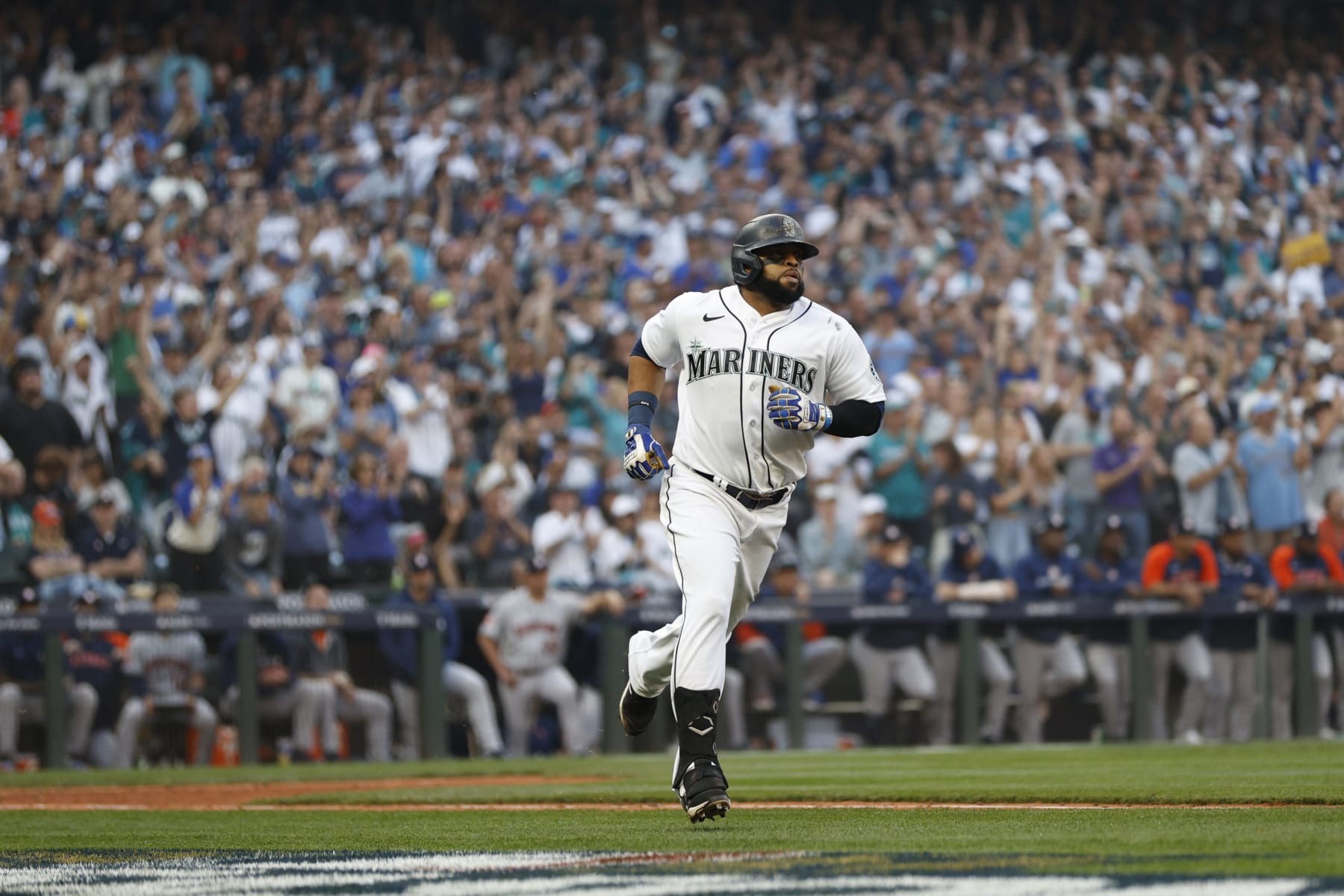 SEATTLE, WASHINGTON - OCTOBER 15: Carlos Santana #41 of the Seattle Mariners single during the twelfth inning against the Houston Astros in game three of the American League Division Series at T-Mobile Park on October 15, 2022 in Seattle, Washington. (Photo by Steph Chambers/Getty Images)
