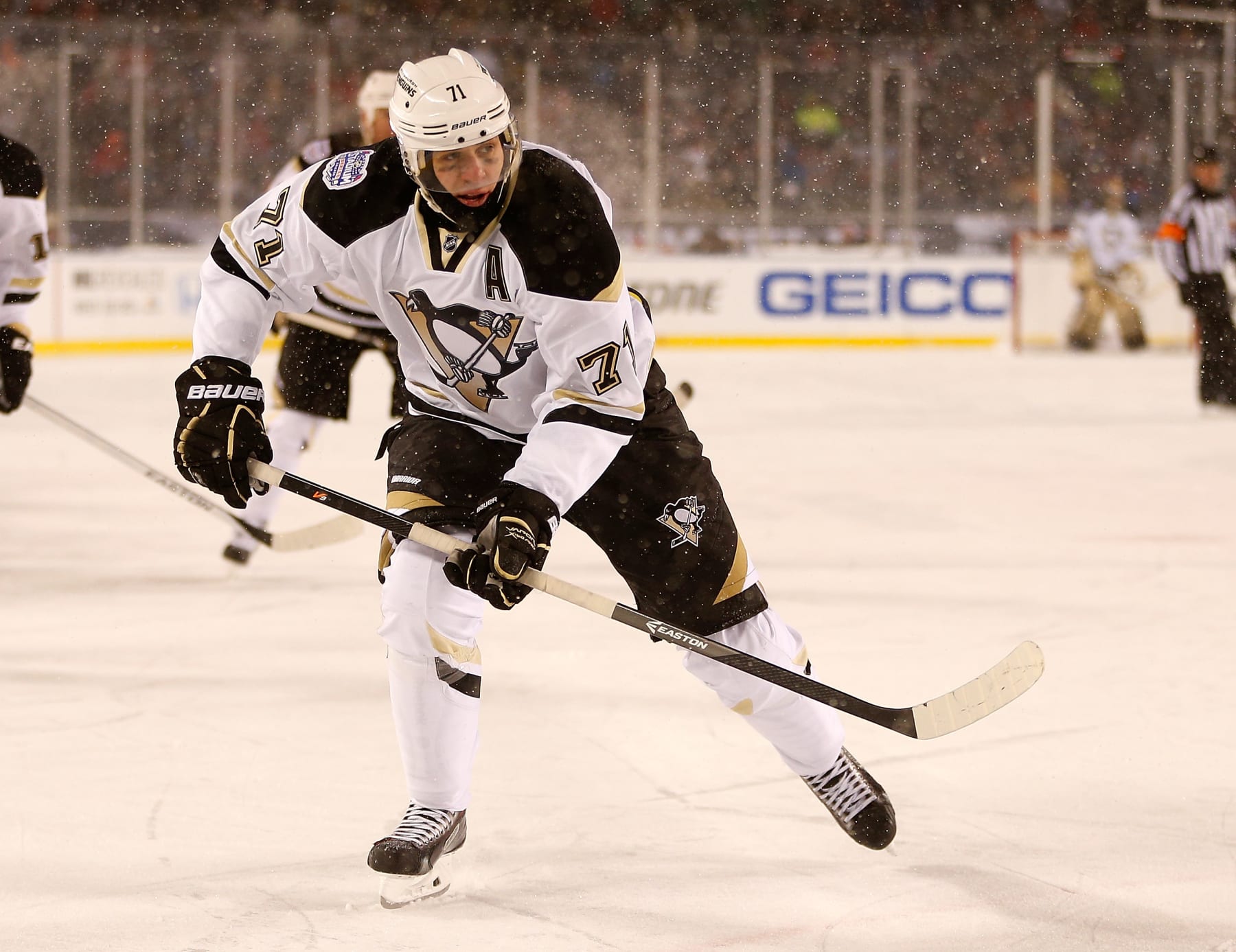 CHICAGO, IL - MARCH 1: (EDITORIAL USE ONLY) Evgeni Malkin #71 of the Pittsburgh Penguins skates against the Chicago Blackhawks during the 2014 NHL Stadium Series game on March 1, 2014 at Soldier Field in Chicago, Illinois.  (Photo by Gregory Shamus/NHLI via Getty Images) 