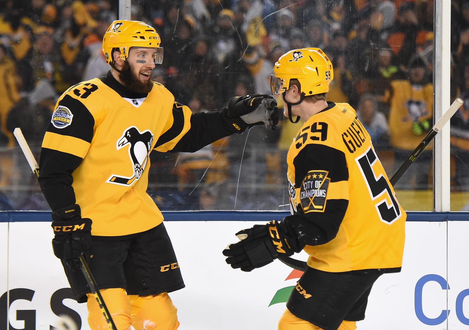 PITTSBURGH, PA - FEBRUARY 25:  Nick Bonino #13 of the Pittsburgh Penguins celebrates his goal with Jake Guentzel #59 during the second period of the 2017 Coors Light NHL Stadium Series game at Heinz Field on February 25, 2017 in Pittsburgh, Pennsylvania.  (Photo by Brian Babineau/NHLI via Getty Images)