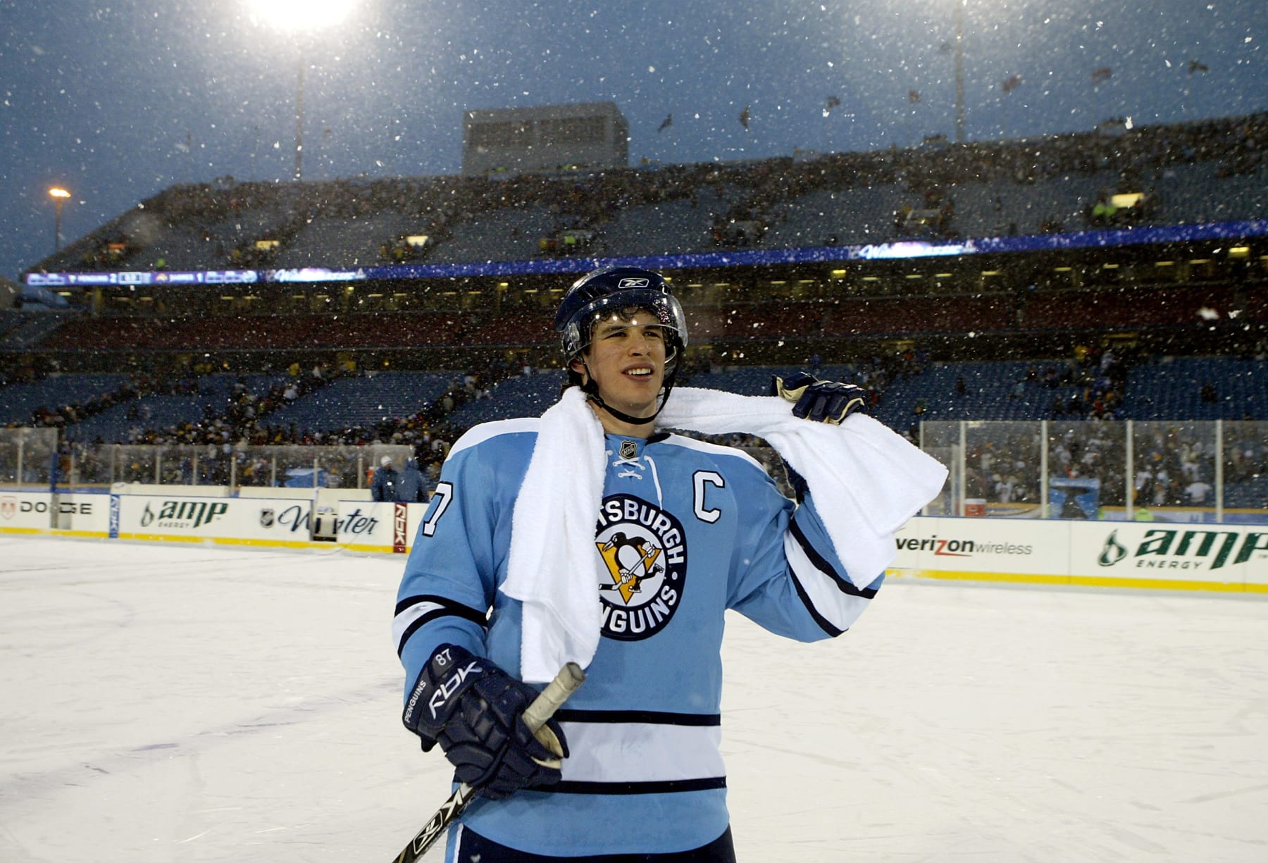 ORCHARD PARK, NY - JANUARY 01:  Sidney Crosby #87 of the Pittsburgh Penguins smiles as he skates on the ice after scoring the winning shoot out goal in the NHL Winter Classic against the Buffalo Sabres at the Ralph Wilson Stadium on January 1, 2008 in Orchard Park, New York.  The Penguins won the game 2-1 in a shoot out.  (Photo by Dave Sandford/Getty Images)