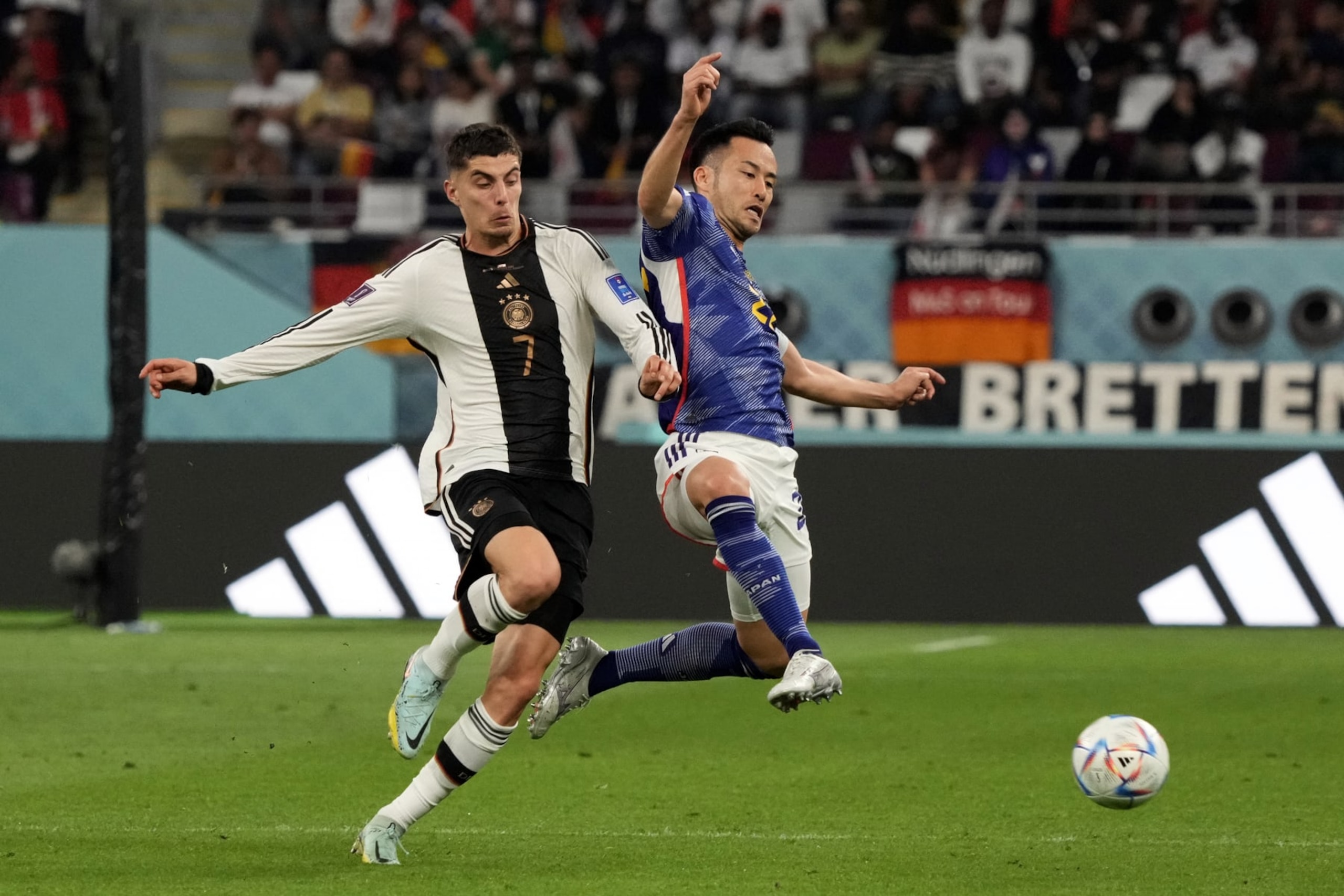 DOHA, QATAR - NOVEMBER 23: Maya Yoshida of Japan and Kai Havertz of Germany in action during the FIFA World Cup Qatar 2022 Group E match between Germany and Japan at Khalifa International Stadium on November 23, 2022 in Doha, Qatar. (Photo by Koji Watanabe/Getty Images) DOHA, QATAR - NOVEMBER 23: Maya Yoshida of Japan and Kai Havertz of Germany in action during the FIFA World Cup Qatar 2022 Group E match between Germany and Japan at Khalifa International Stadium on November 23, 2022 in Doha, Qatar. (Photo by Koji Watanabe/Getty Images)