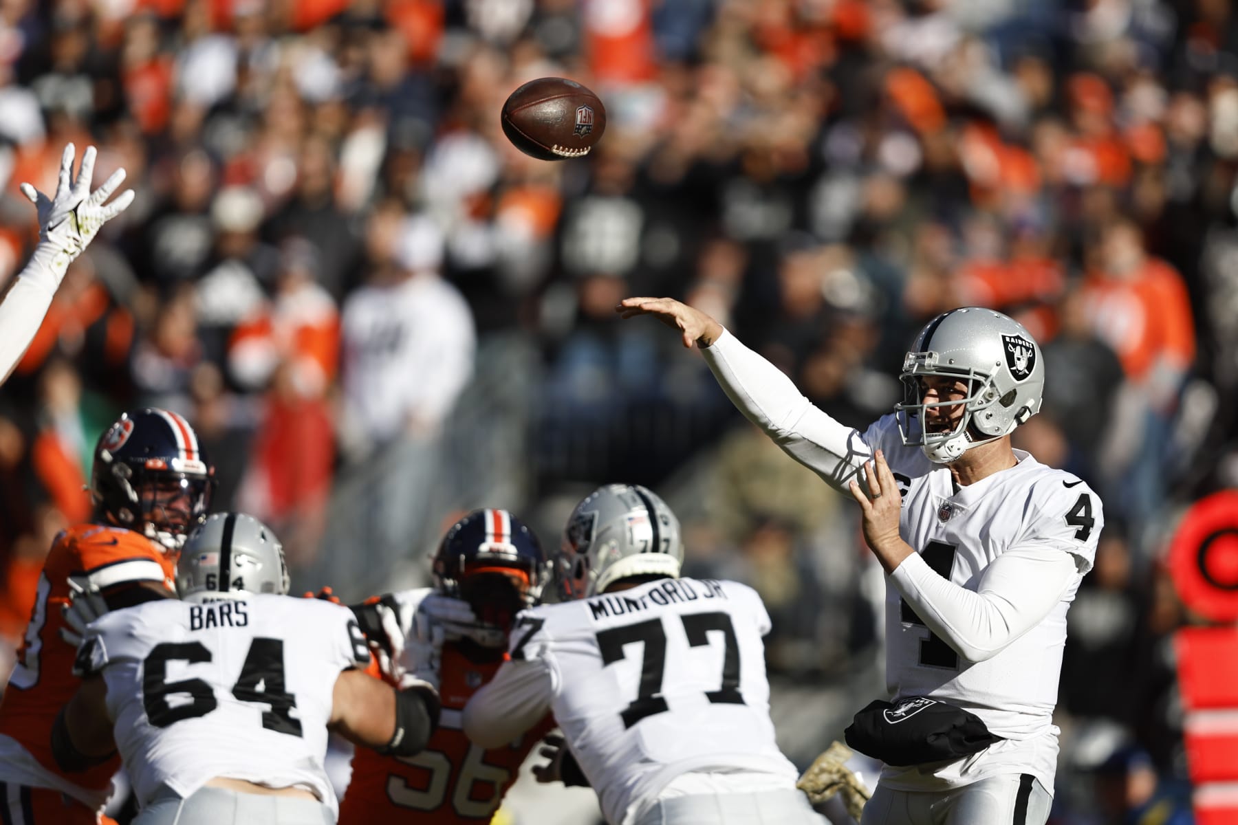 DENVER, COLORADO - NOVEMBER 20: Derek Carr #4 of the Las Vegas Raiders passes during an NFL game between the Las Vegas Raiders and Denver Broncos at Empower Field At Mile High on November 20, 2022 in Denver, Colorado. (Photo by Michael Owens/Getty Images)