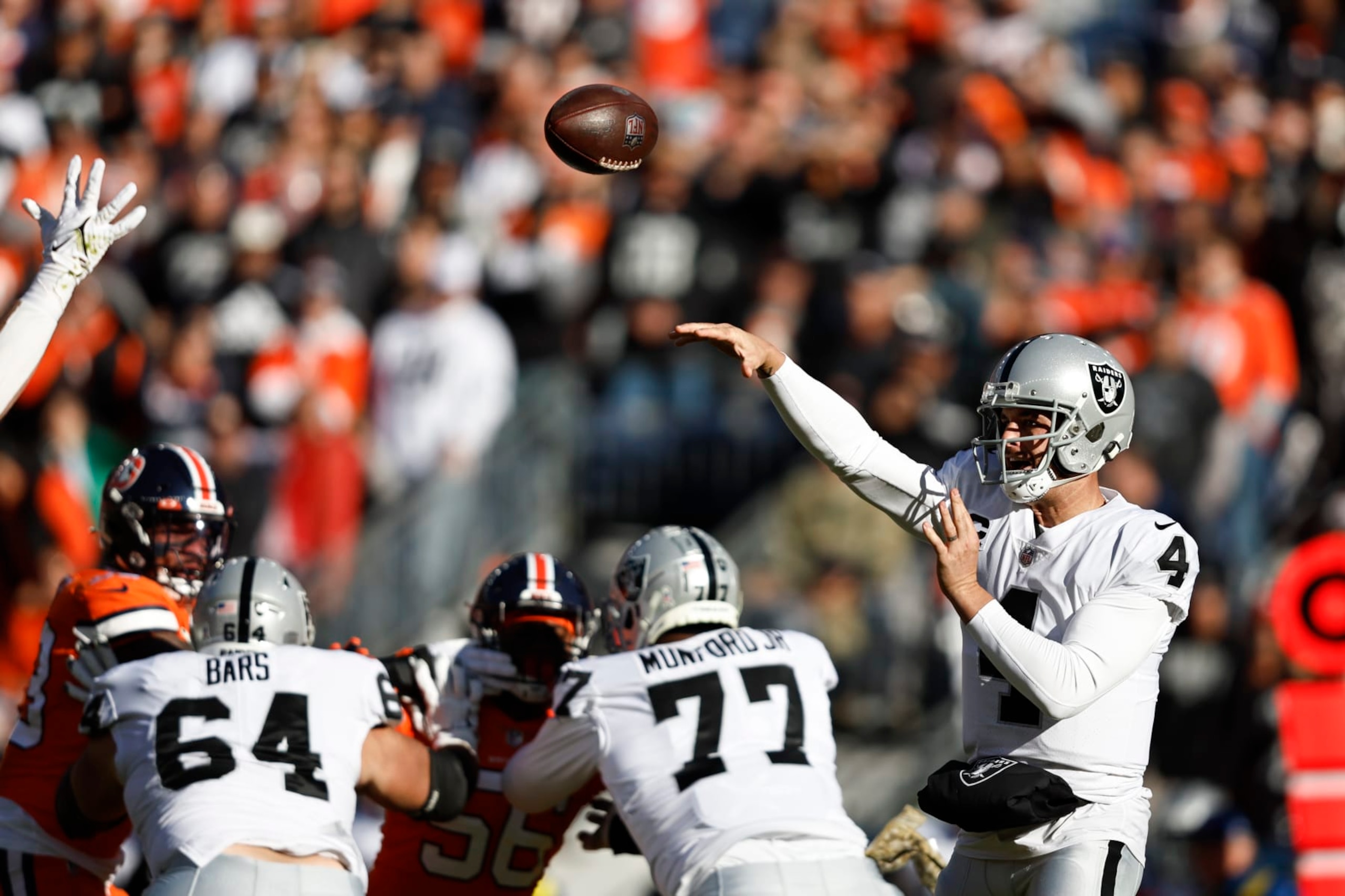 DENVER, COLORADO - NOVEMBER 20: Derek Carr #4 of the Las Vegas Raiders passes during an NFL game between the Las Vegas Raiders and Denver Broncos at Empower Field At Mile High on November 20, 2022 in Denver, Colorado. (Photo by Michael Owens/Getty Images) DENVER, COLORADO - NOVEMBER 20: Derek Carr #4 of the Las Vegas Raiders passes during an NFL game between the Las Vegas Raiders and Denver Broncos at Empower Field At Mile High on November 20, 2022 in Denver, Colorado. (Photo by Michael Owens/Getty Images)