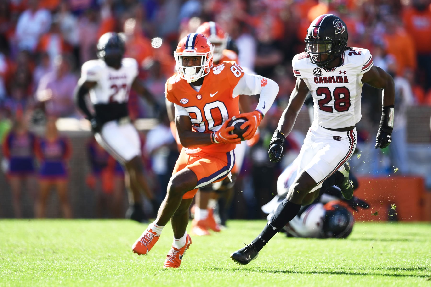 CLEMSON, SOUTH CAROLINA - NOVEMBER 26: Beaux Collins #80 of the Clemson Tigers runs the ball against Darius Rush #28 of the South Carolina Gamecocks in the second quarter at Memorial Stadium on November 26, 2022 in Clemson, South Carolina. (Photo by Eakin Howard/Getty Images)