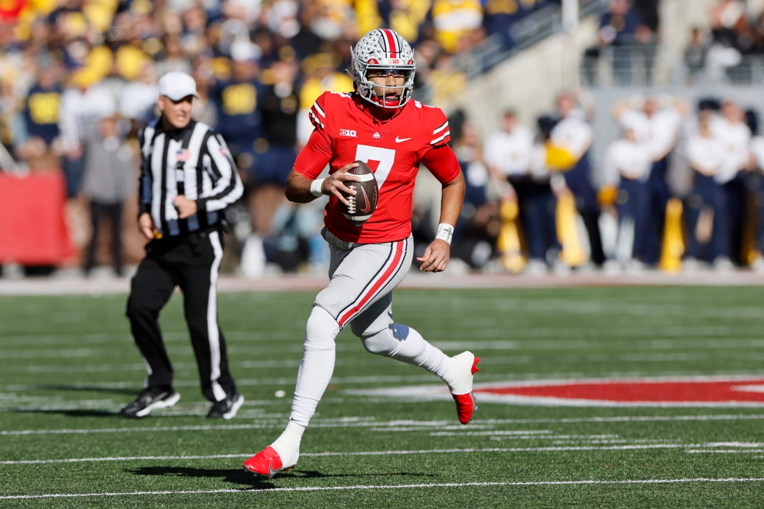 Ohio State quarterback C.J. Stroud looks for an open pass against Michigan during the first half of an NCAA college football game on Saturday, Nov. 26, 2022, in Columbus, Ohio. (AP Photo/Jay LaPrete) Ohio State quarterback C.J. Stroud looks for an open pass against Michigan during the first half of an NCAA college football game on Saturday, Nov. 26, 2022, in Columbus, Ohio. (AP Photo/Jay LaPrete)
