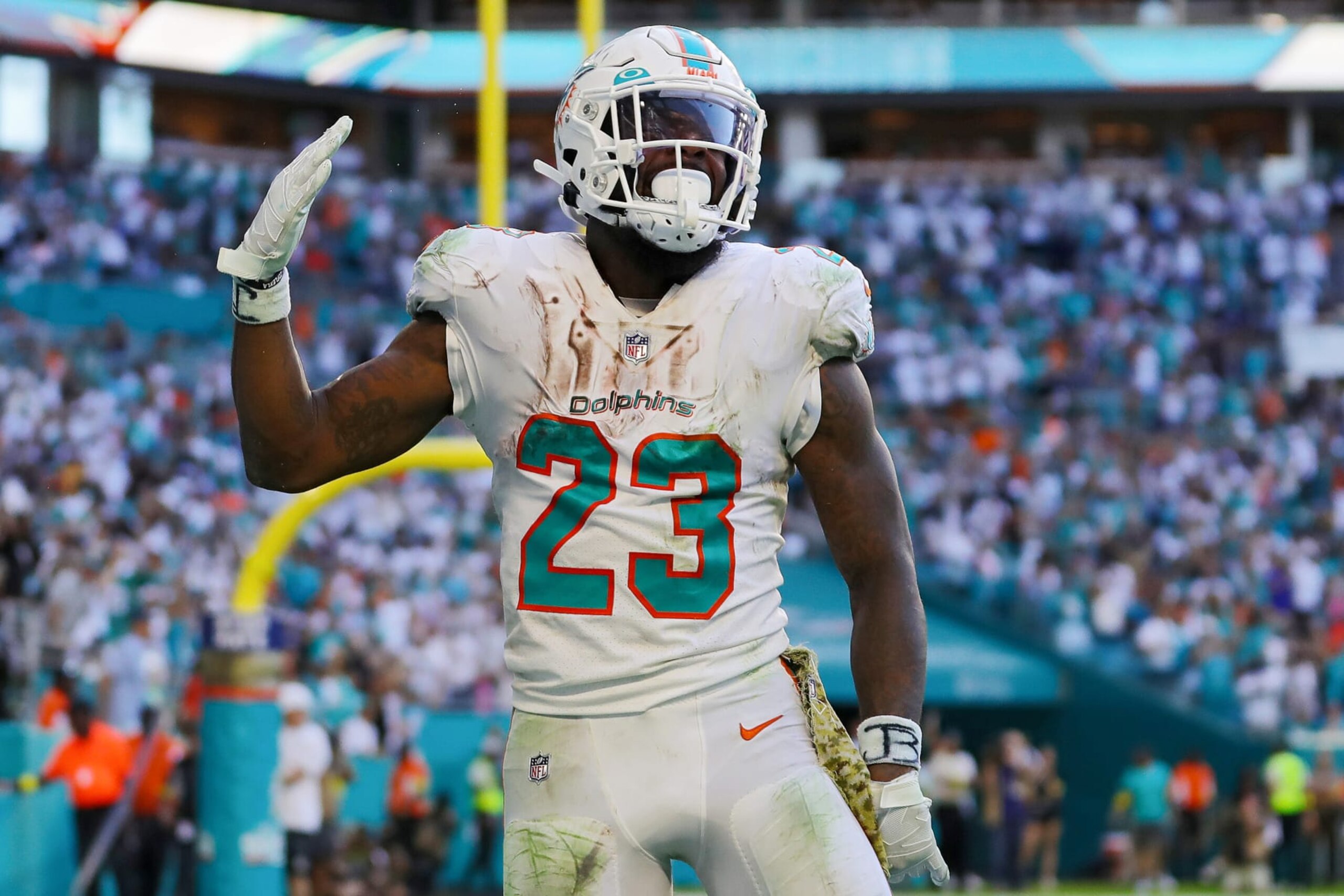 MIAMI GARDENS, FLORIDA - NOVEMBER 13: Jeff Wilson Jr. #23 of the Miami Dolphins celebrates after scoring a touchdown in the fourth quarter of the game against the Cleveland Browns at Hard Rock Stadium on November 13, 2022 in Miami Gardens, Florida. (Photo by Megan Briggs/Getty Images)