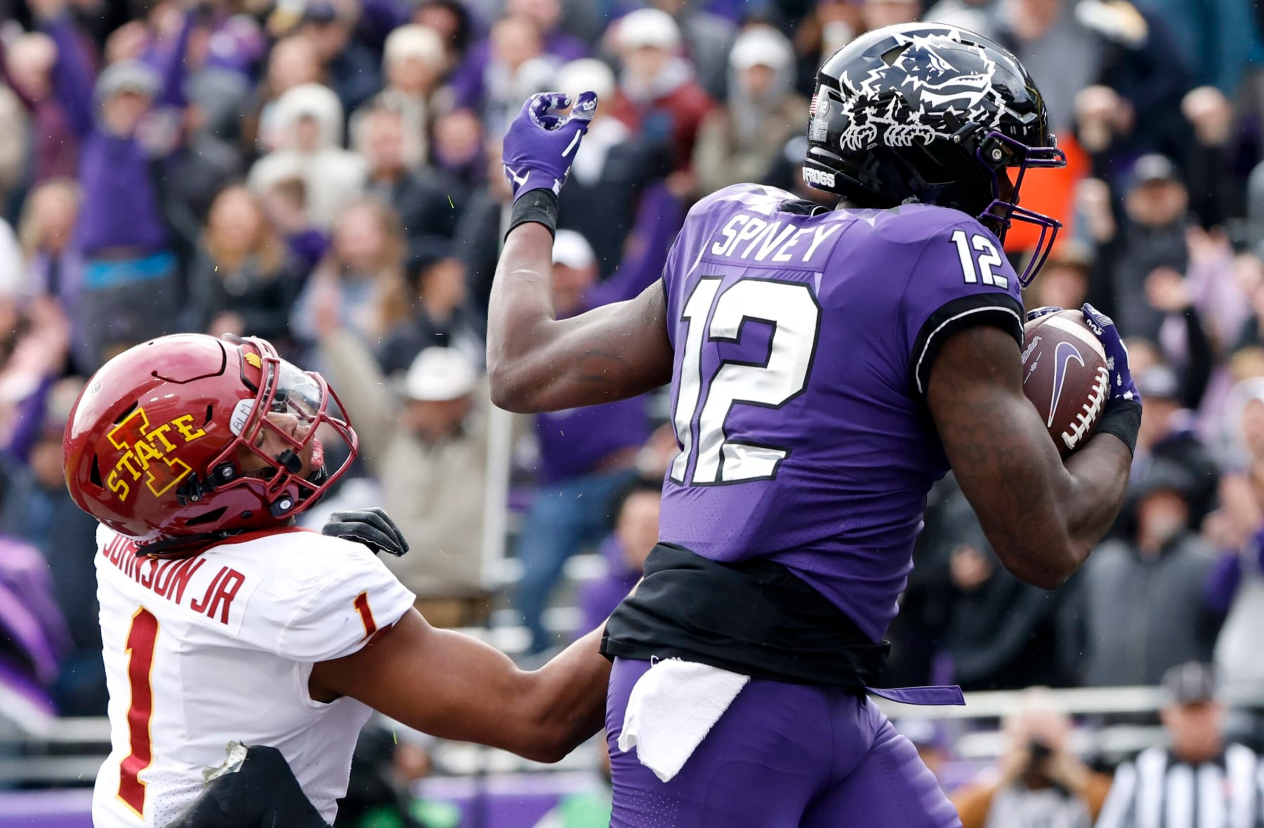 FORT WORTH, TX - NOVEMBER 26: Tight end Geor'Quarius Spivey #12 of the TCU Horned Frogs catches a touchdown pass as defensive back Anthony Johnson Jr. #1 of the Iowa State Cyclones defends during the first half at Amon G. Carter Stadium on November 26, 2022 in Fort Worth, Texas. (Photo by Ron Jenkins/Getty Images) FORT WORTH, TX - NOVEMBER 26: Tight end Geor'Quarius Spivey #12 of the TCU Horned Frogs catches a touchdown pass as defensive back Anthony Johnson Jr. #1 of the Iowa State Cyclones defends during the first half at Amon G. Carter Stadium on November 26, 2022 in Fort Worth, Texas. (Photo by Ron Jenkins/Getty Images)
