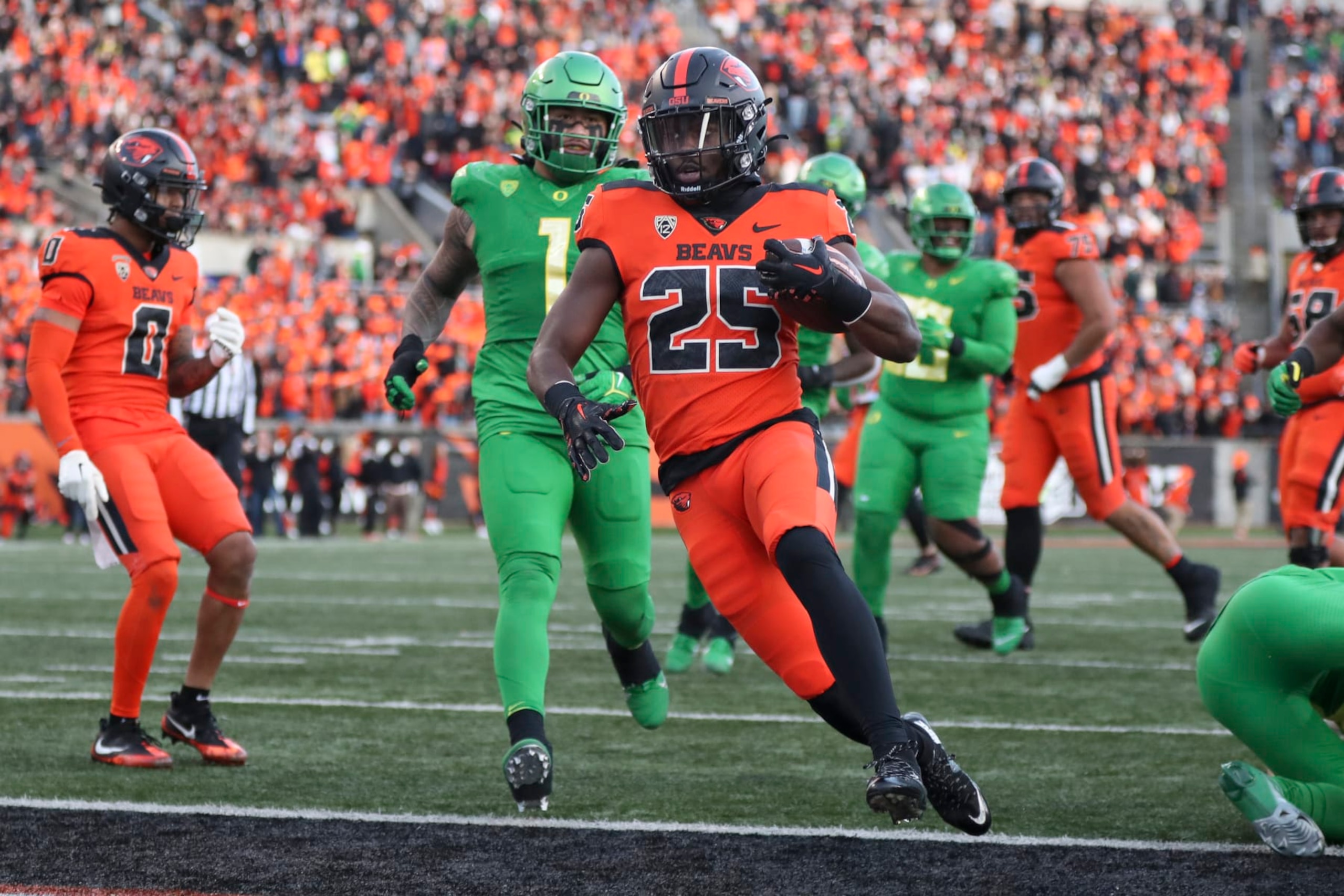Oregon State running back Isaiah Newell (25) scores a touchdown against Oregon during the second half of an NCAA college football game on Saturday, Nov 26, 2022, in Corvallis, Ore. (AP Photo/Amanda Loman)