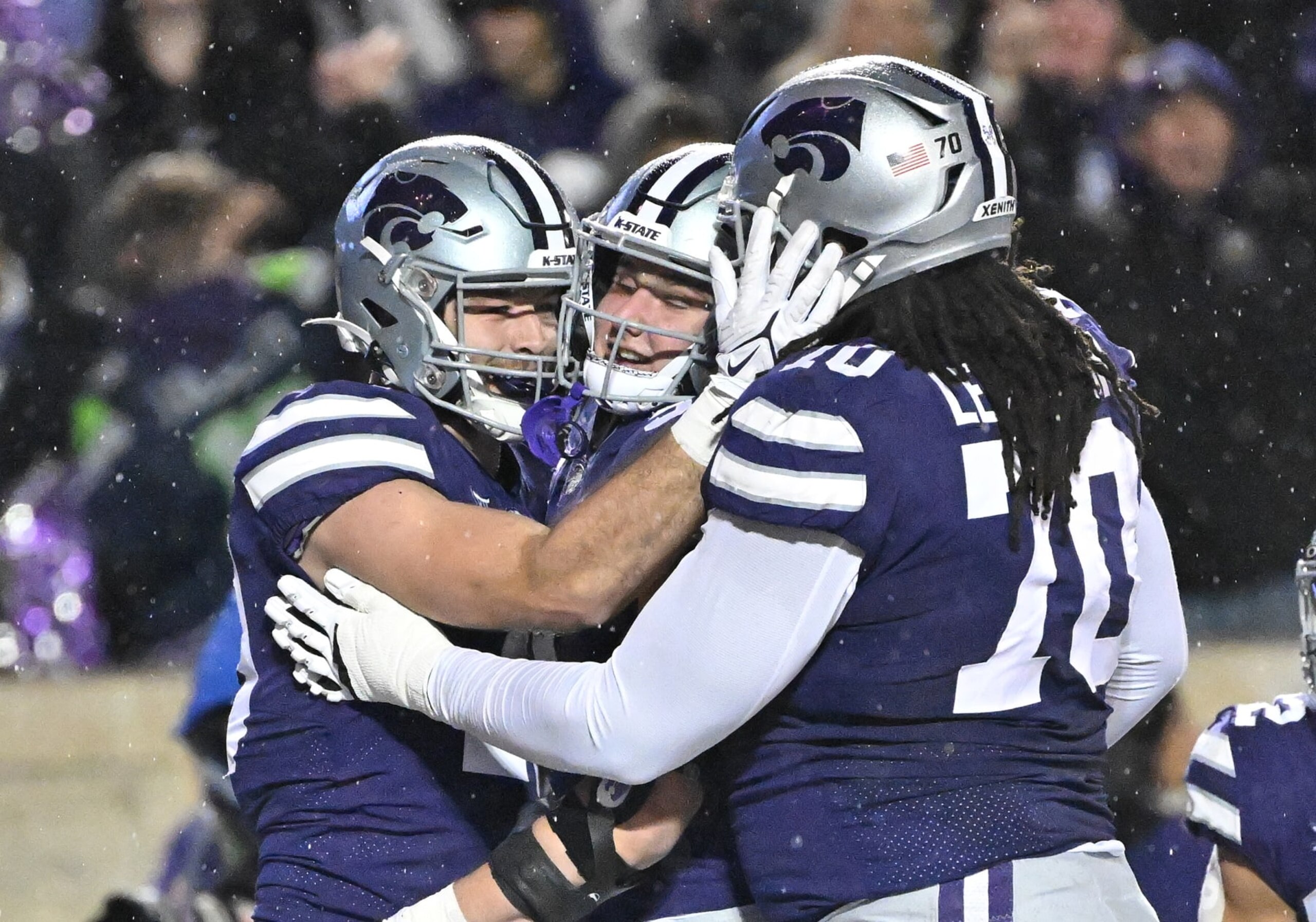 MANHATTAN, KS - NOVEMBER 26: Tight end Sammy Wheeler #19 of the Kansas State Wildcats celebrates with teammates after a touchdown against the Kansas Jayhawks during the first half at Bill Snyder Family Football Stadium on November 26, 2022 in Manhattan, Kansas. (Photo by Peter Aiken/Getty Images) MANHATTAN, KS - NOVEMBER 26: Tight end Sammy Wheeler #19 of the Kansas State Wildcats celebrates with teammates after a touchdown against the Kansas Jayhawks during the first half at Bill Snyder Family Football Stadium on November 26, 2022 in Manhattan, Kansas. (Photo by Peter Aiken/Getty Images)