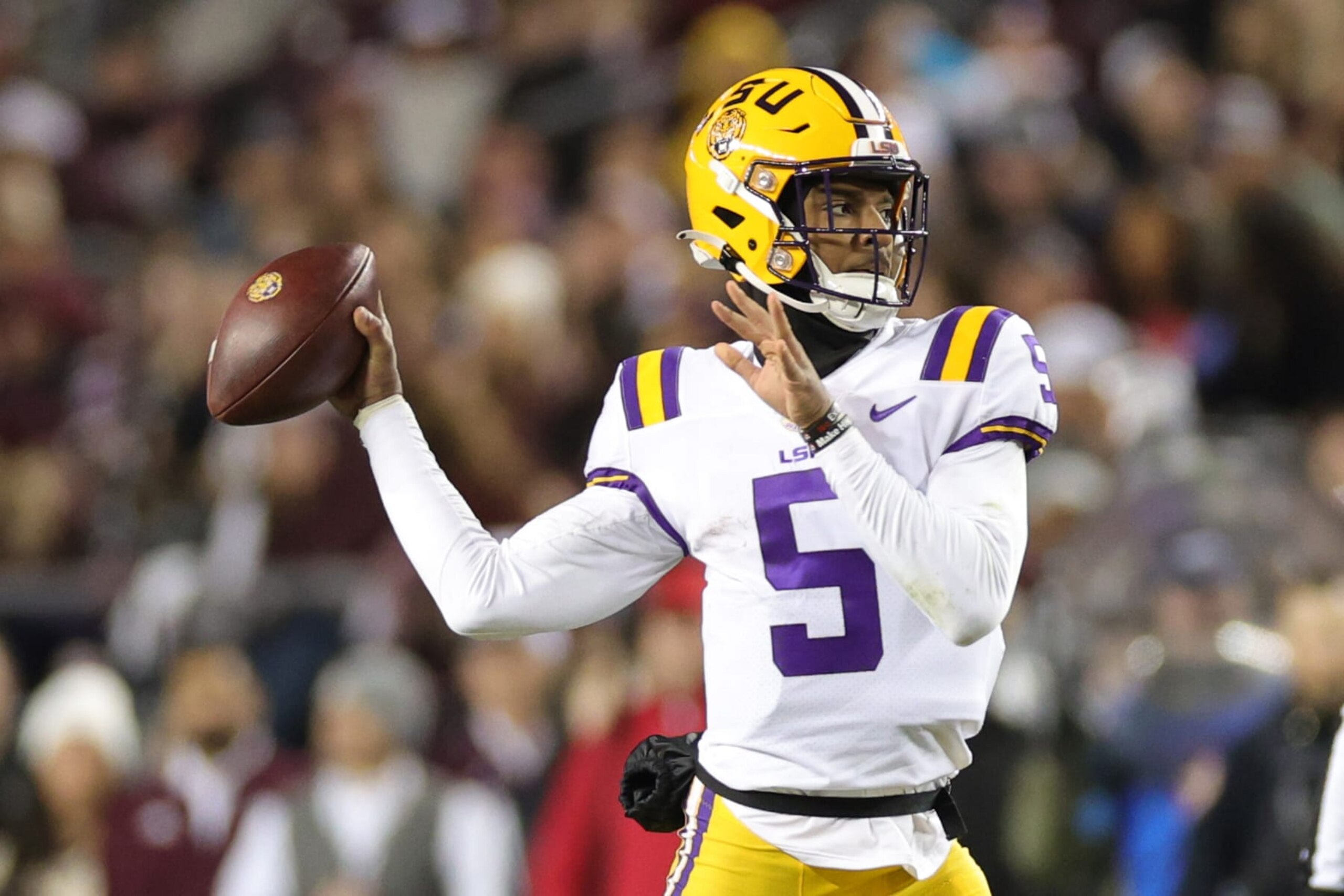 COLLEGE STATION, TEXAS - NOVEMBER 26: Jayden Daniels #5 of the LSU Tigers looks to pass against the Texas A&M Aggies during the first half at Kyle Field on November 26, 2022 in College Station, Texas. (Photo by Carmen Mandato/Getty Images)