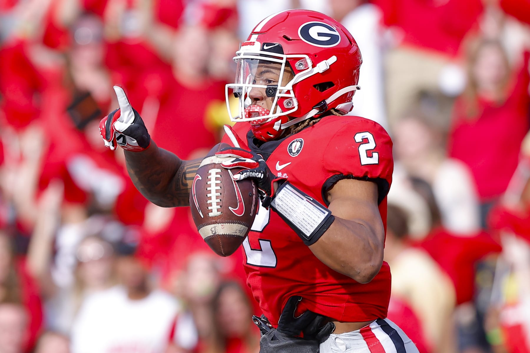 ATHENS, GA - NOVEMBER 26: Kendall Milton #2 of the Georgia Bulldogs reacts after scoring a touchdown in the second half against the Georgia Tech Yellow Jackets at Sanford Stadium on November 26, 2022 in Athens, Georgia. (Photo by Todd Kirkland/Getty Images)