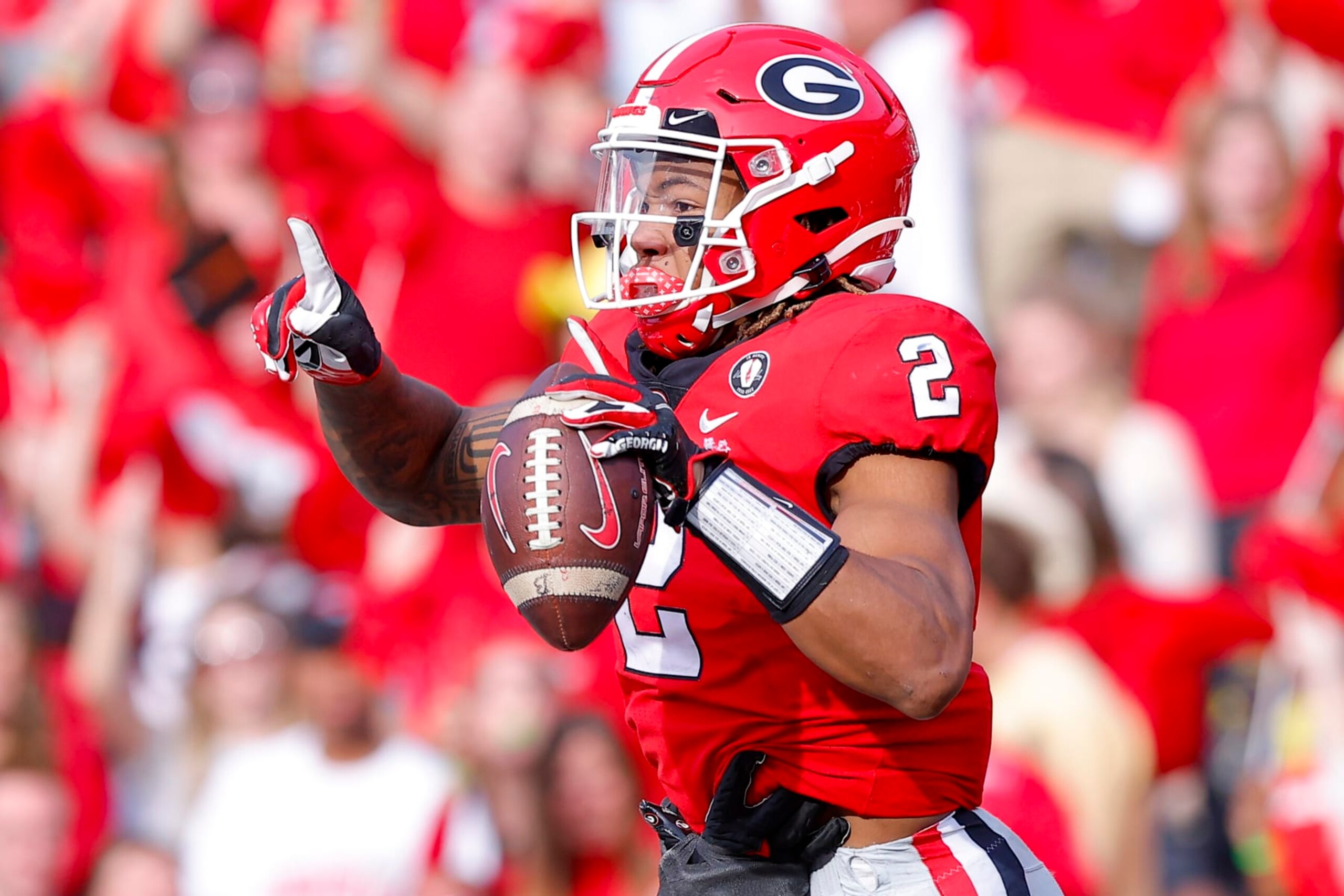 ATHENS, GA - NOVEMBER 26: Kendall Milton #2 of the Georgia Bulldogs reacts after scoring a touchdown in the second half against the Georgia Tech Yellow Jackets at Sanford Stadium on November 26, 2022 in Athens, Georgia. (Photo by Todd Kirkland/Getty Images)