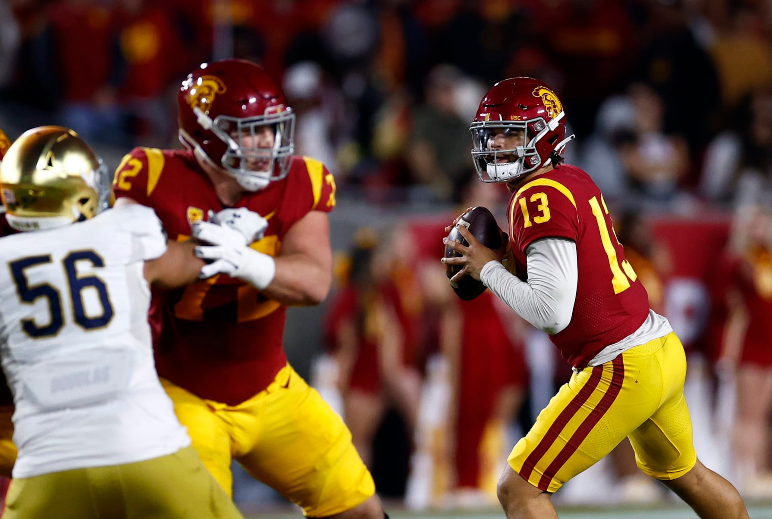 LOS ANGELES, CALIFORNIA - NOVEMBER 26:  Caleb Williams #13 of the USC Trojans throws against the Notre Dame Fighting Irish in the first half at United Airlines Field at the Los Angeles Memorial Coliseum on November 26, 2022 in Los Angeles, California. (Photo by Ronald Martinez/Getty Images)