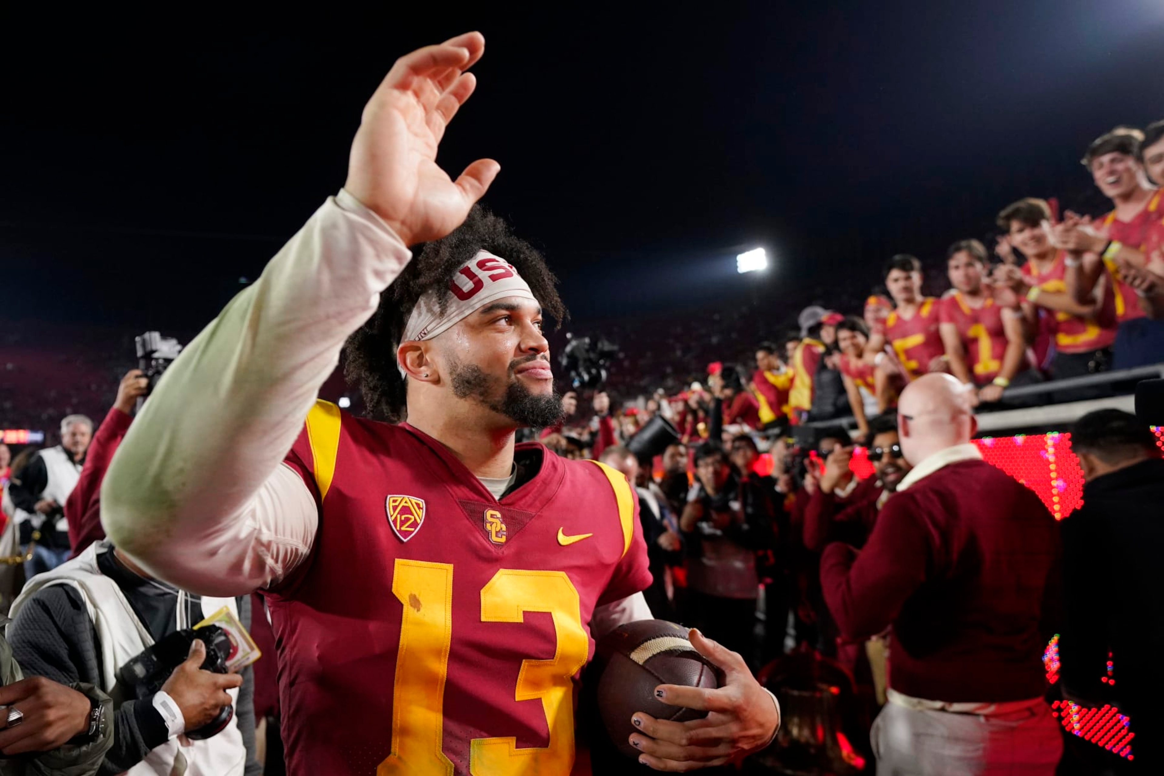 Southern California quarterback Caleb Williams waves to fans after USC defeated Notre Dame 38-27 an NCAA college football game Saturday, Nov. 26, 2022, in Los Angeles. (AP Photo/Mark J. Terrill) Southern California quarterback Caleb Williams waves to fans after USC defeated Notre Dame 38-27 an NCAA college football game Saturday, Nov. 26, 2022, in Los Angeles. (AP Photo/Mark J. Terrill)