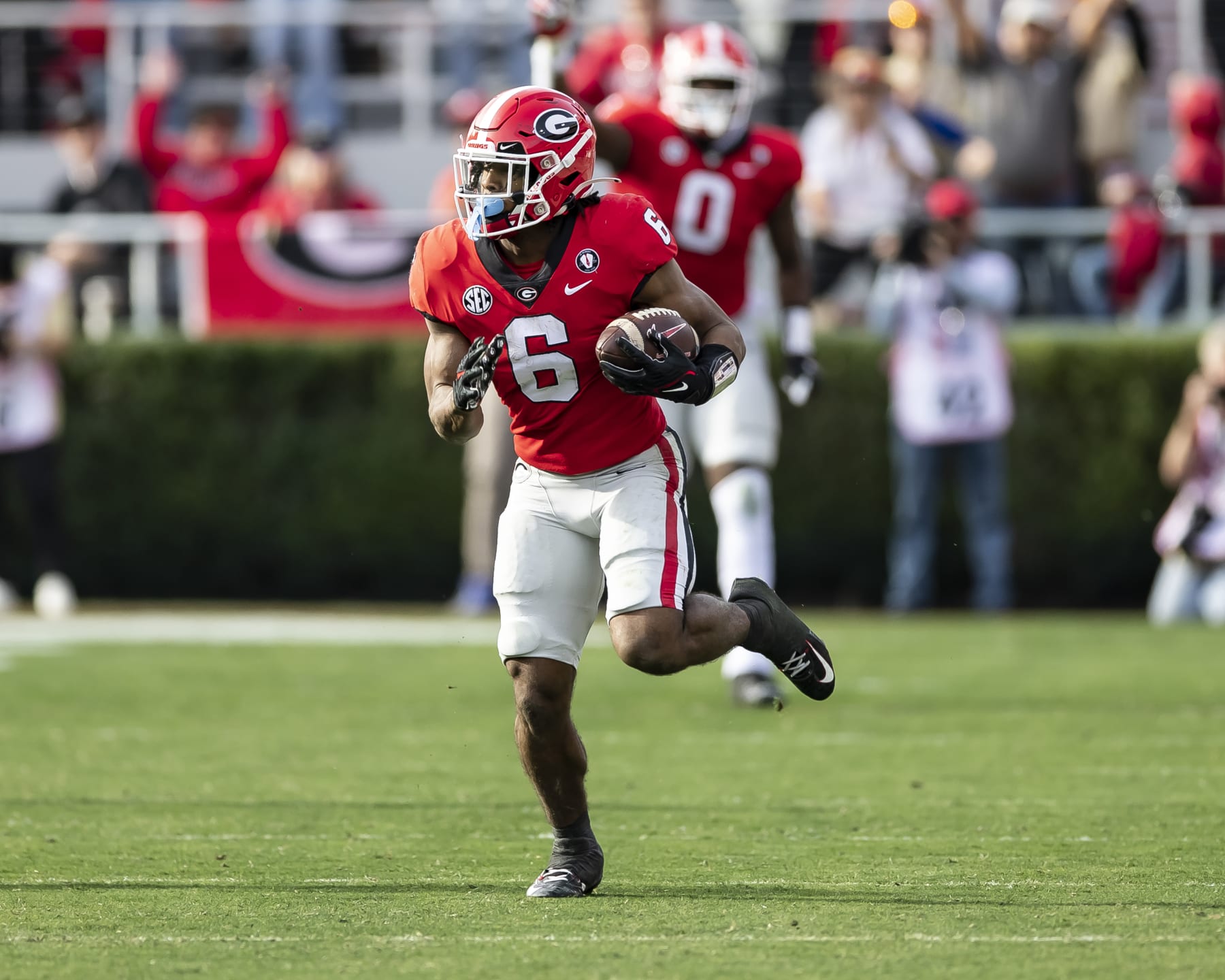ATHENS, GA - NOVEMBER 26: Kenny McIntosh #6 of the Georgia Bulldogs breaks into the open field for a long run during a game between Georgia Tech Yellow Jackets and Georgia Bulldogs at Sanford Stadium on November 26, 2022 in Athens, Georgia. (Photo by Steve Limentani/ISI Photos/Getty Images)