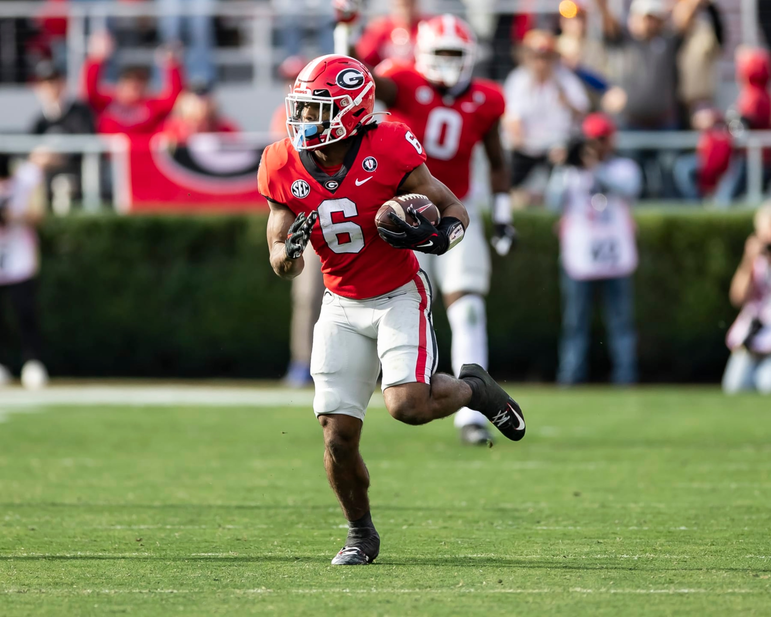 ATHENS, GA - NOVEMBER 26: Kenny McIntosh #6 of the Georgia Bulldogs breaks into the open field for a long run during a game between Georgia Tech Yellow Jackets and Georgia Bulldogs at Sanford Stadium on November 26, 2022 in Athens, Georgia. (Photo by Steve Limentani/ISI Photos/Getty Images)