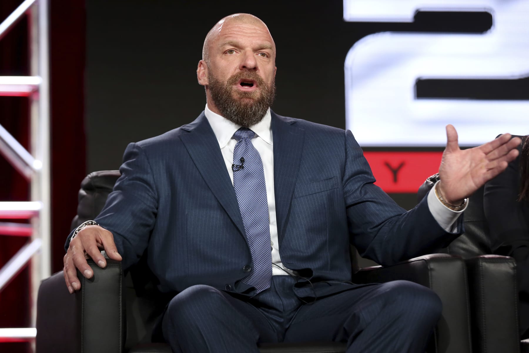 FILE - In this Jan. 9, 2018, file photo, Paul "Triple H" Levesque participates in the "WWE Monday Night Raw: 25th Anniversary" panel during the NBCUniversal Television Critics Association Winter Press Tour in Pasadena, Calif. While real sports have shut down in the wake of the coronavirus pandemic, WWE has pressed on and is set to run this weekend its first WrestleMania in an empty arena. “We just feel like it is the right time,” WWE executive Levesque said. (Photo by Willy Sanjuan/Invision/AP)