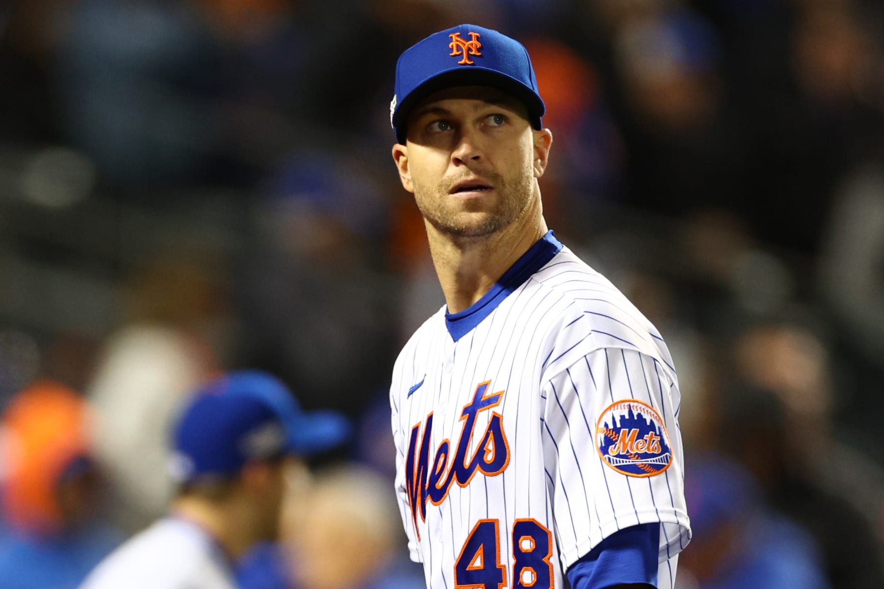 NEW YORK, NEW YORK - OCTOBER 08: Jacob deGrom #48 of the New York Mets walks out of the fourth inning against the San Diego Padres in game two of the Wild Card Series at Citi Field on October 08, 2022 in New York City. (Photo by Elsa/Getty Images)