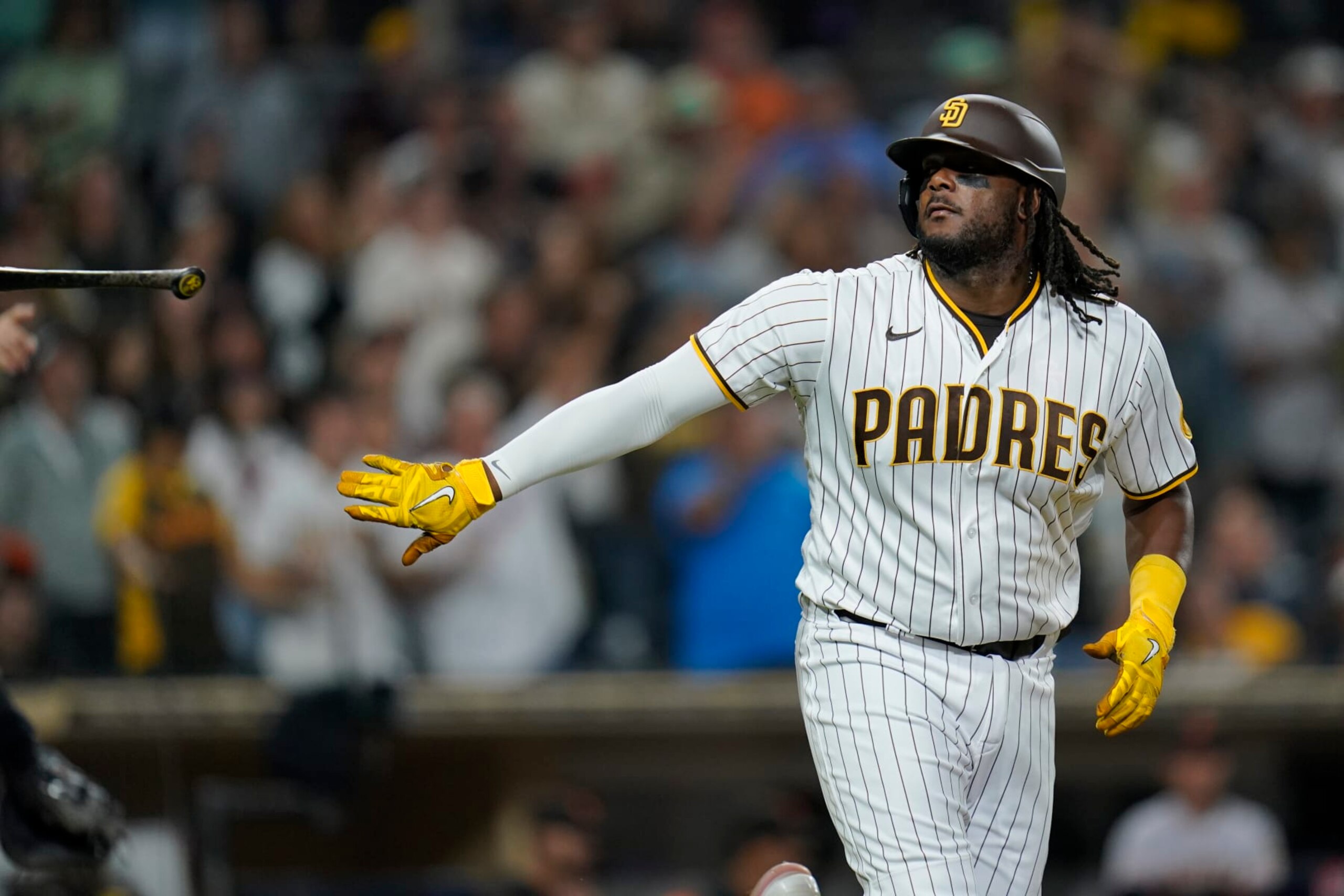 San Diego Padres' Josh Bell tosses his bat as he walks with the bases loaded during the eighth inning of a baseball game against the San Francisco Giants, Monday, Oct. 3, 2022, in San Diego. San Diego Padres' Brandon Dixon scored on the play. (AP Photo/Gregory Bull) San Diego Padres' Josh Bell tosses his bat as he walks with the bases loaded during the eighth inning of a baseball game against the San Francisco Giants, Monday, Oct. 3, 2022, in San Diego. San Diego Padres' Brandon Dixon scored on the play. (AP Photo/Gregory Bull)