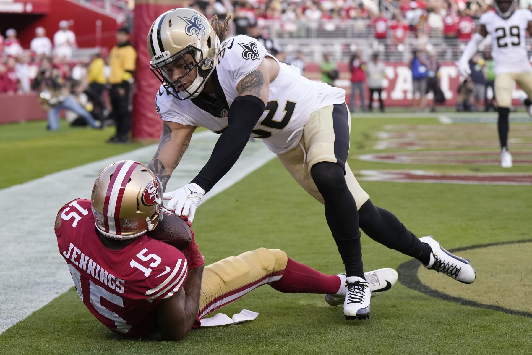 SANTA CLARA, CALIFORNIA - NOVEMBER 27: Jauan Jennings #15 of the San Francisco 49ers catches a touchdown pass while defended by Tyrann Mathieu #32 of the New Orleans Saints during the first half at Levi's Stadium on November 27, 2022 in Santa Clara, California. (Photo by Thearon W. Henderson/Getty Images)