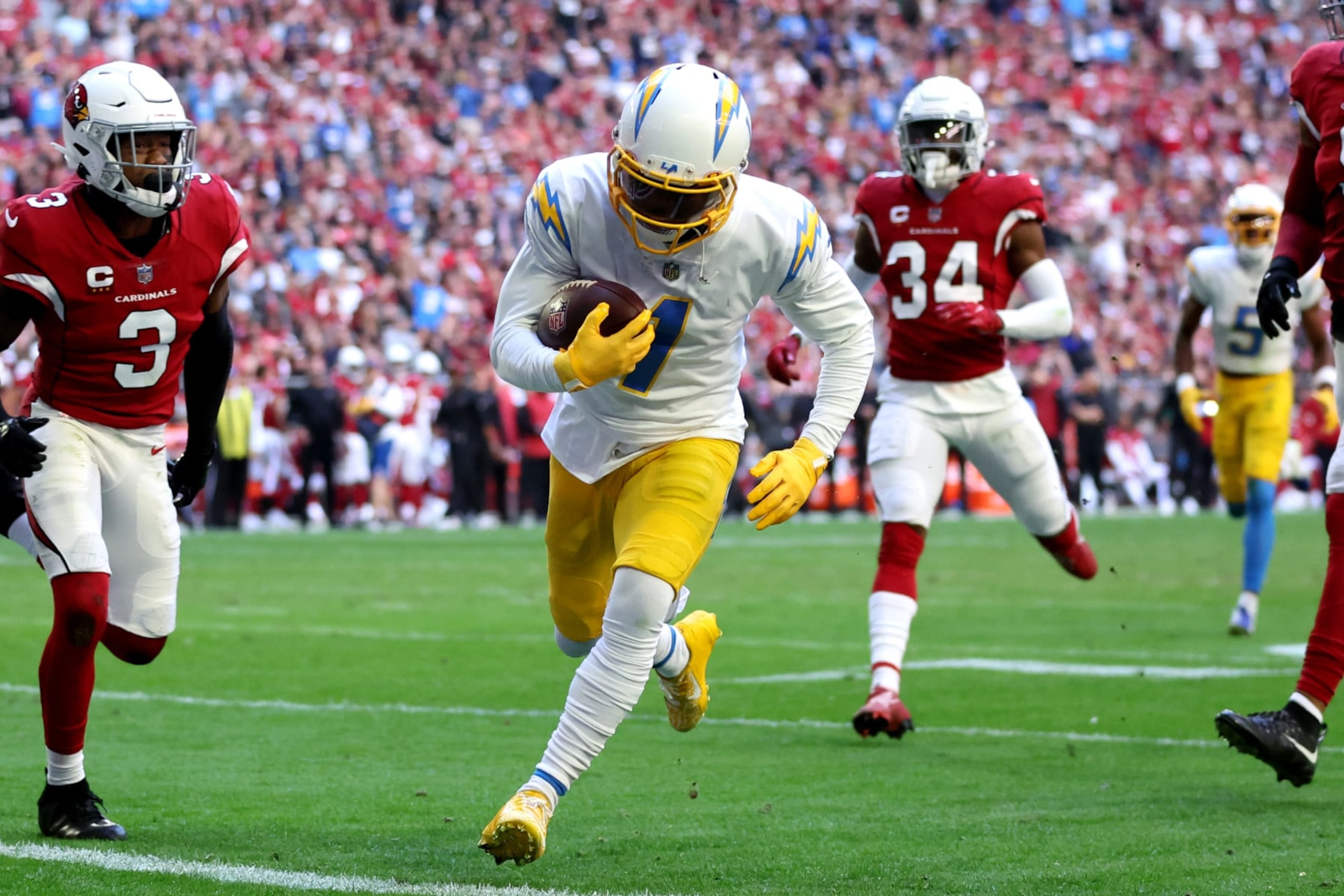 GLENDALE, ARIZONA - NOVEMBER 27: DeAndre Carter #1 of the Los Angeles Chargers scores a touchdown in the second quarter of a game against the Arizona Cardinals at State Farm Stadium on November 27, 2022 in Glendale, Arizona. (Photo by Christian Petersen/Getty Images)