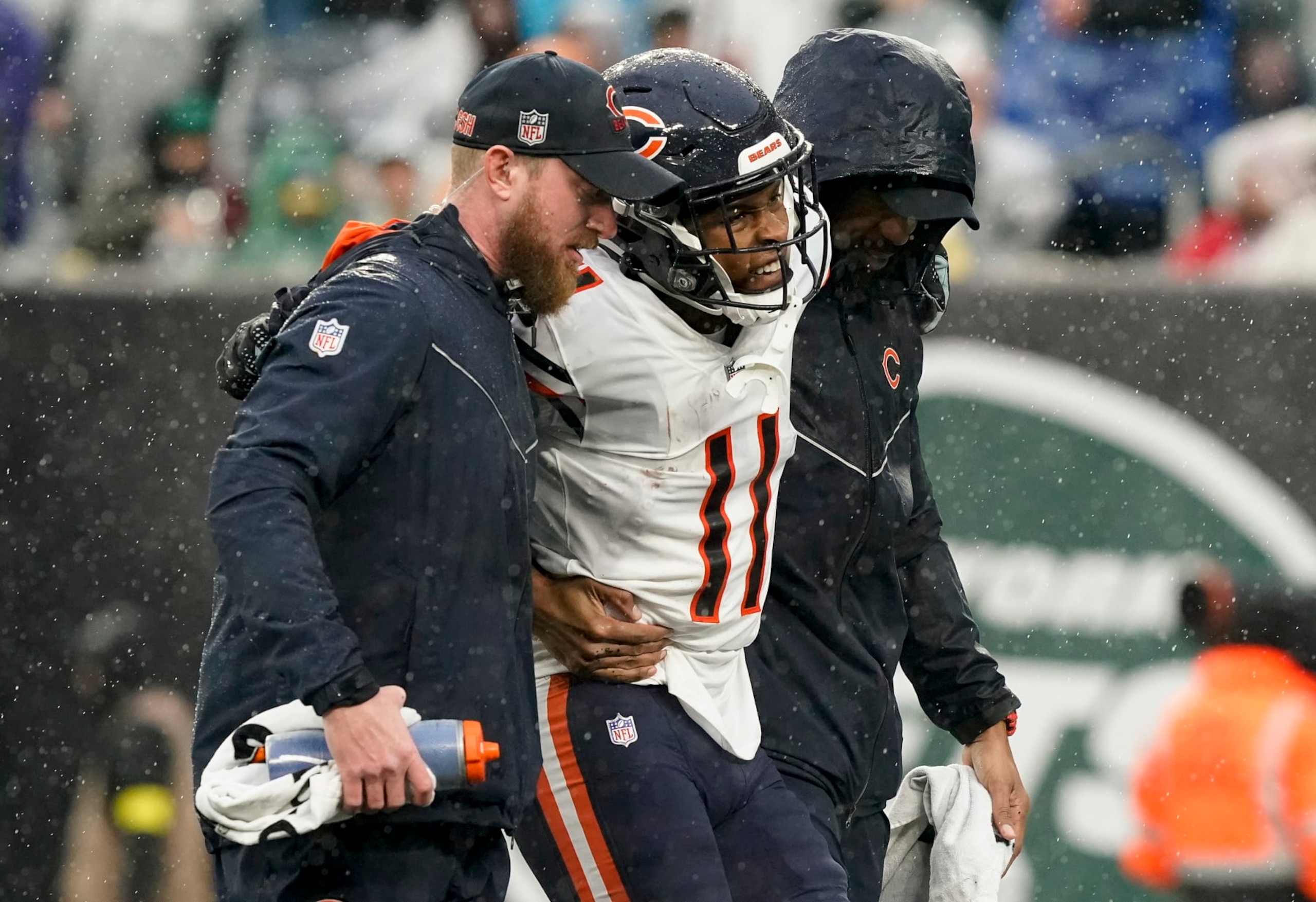Chicago Bears wide receiver Darnell Mooney (11) is helped off the field during the third quarter of an NFL football game against the New York Jets , Sunday, Nov. 27, 2022, in East Rutherford, N.J. (AP Photo/John Minchillo) Chicago Bears wide receiver Darnell Mooney (11) is helped off the field during the third quarter of an NFL football game against the New York Jets , Sunday, Nov. 27, 2022, in East Rutherford, N.J. (AP Photo/John Minchillo)
