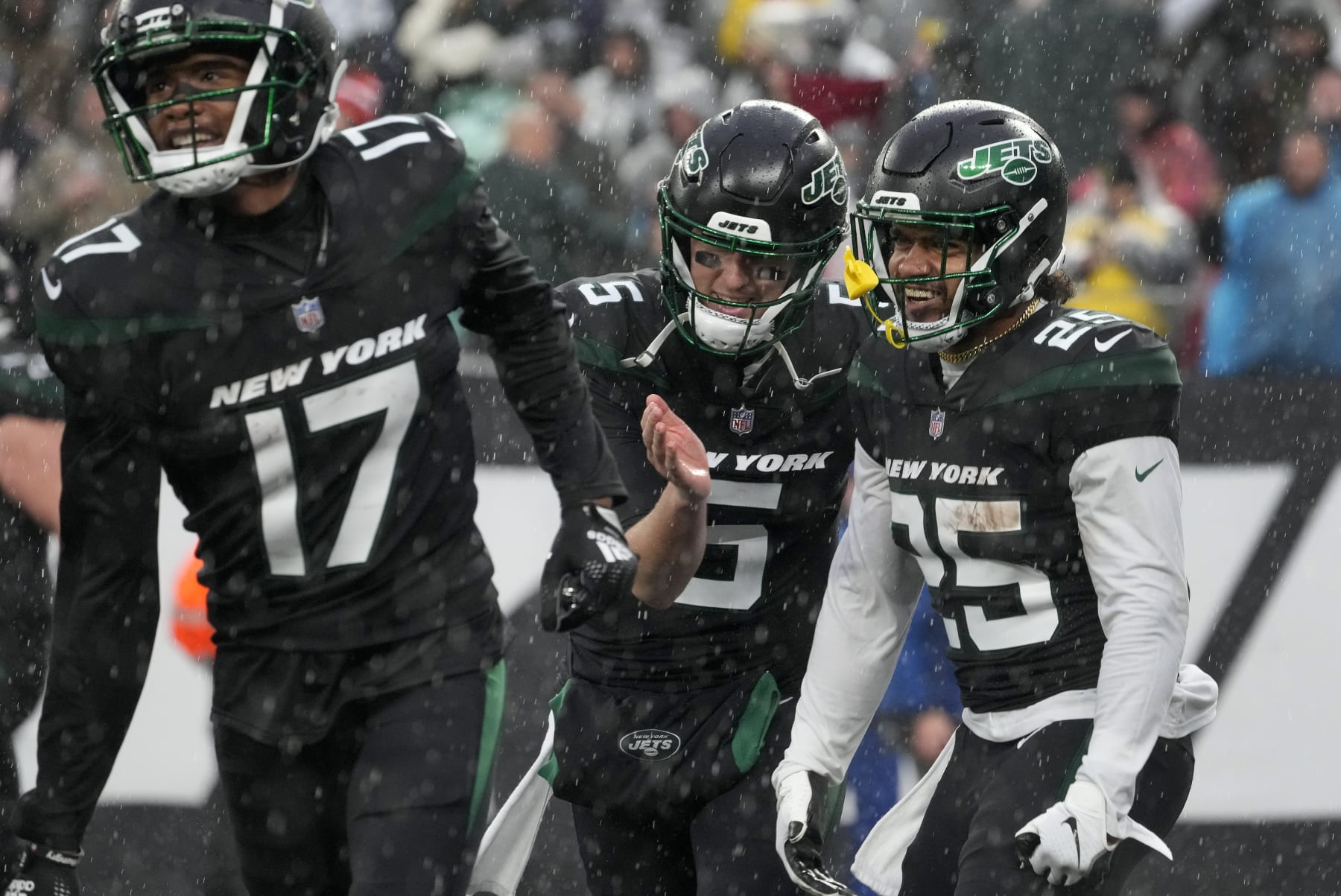 New York Jets running back Ty Johnson (25) and quarterback Mike White (5) celebrate after a touchdown by Johnson against the Chicago Bears during the third quarter of an NFL football game, Sunday, Nov. 27, 2022, in East Rutherford, N.J. (AP Photo/John Minchillo)