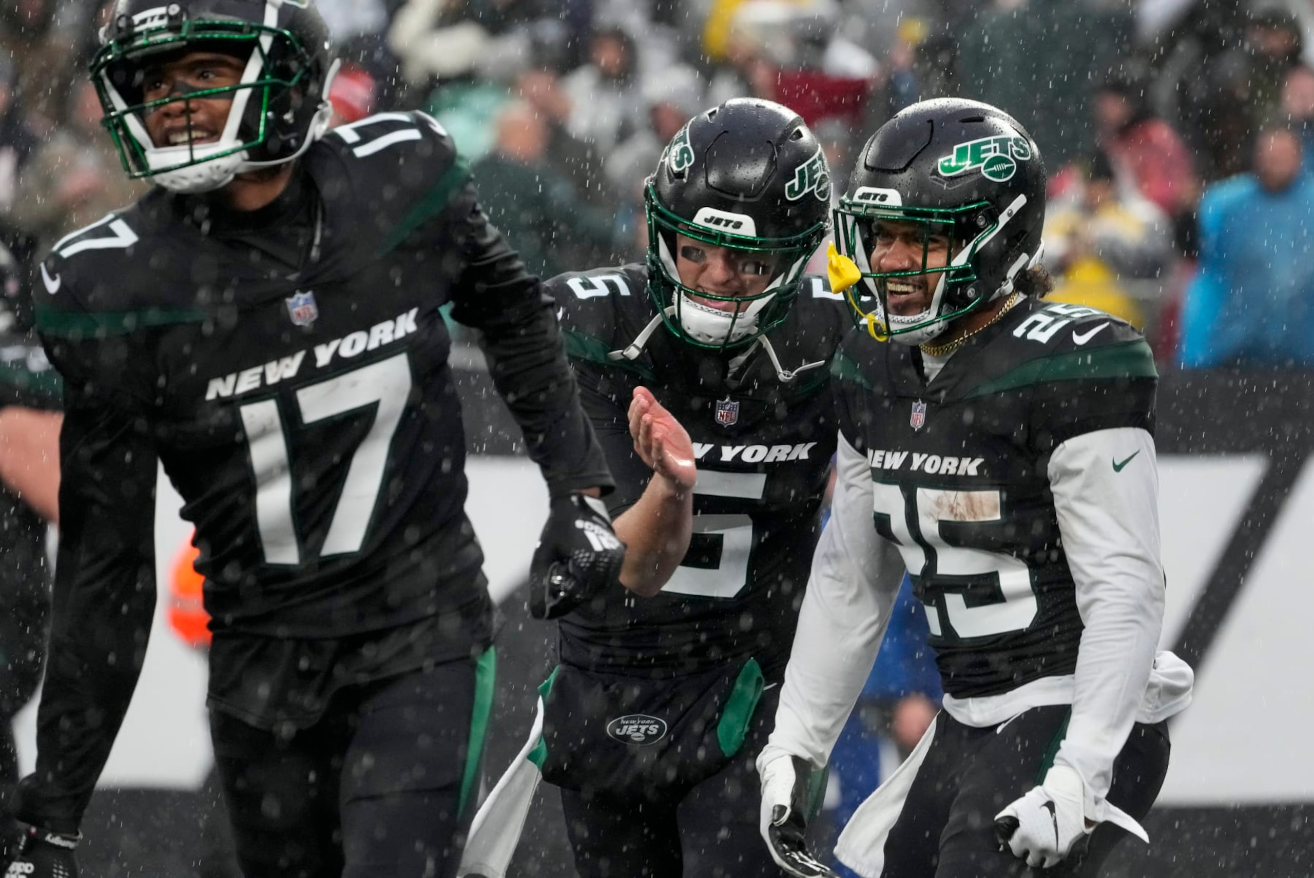 New York Jets running back Ty Johnson (25) and quarterback Mike White (5) celebrate after a touchdown by Johnson against the Chicago Bears during the third quarter of an NFL football game, Sunday, Nov. 27, 2022, in East Rutherford, N.J. (AP Photo/John Minchillo) New York Jets running back Ty Johnson (25) and quarterback Mike White (5) celebrate after a touchdown by Johnson against the Chicago Bears during the third quarter of an NFL football game, Sunday, Nov. 27, 2022, in East Rutherford, N.J. (AP Photo/John Minchillo)