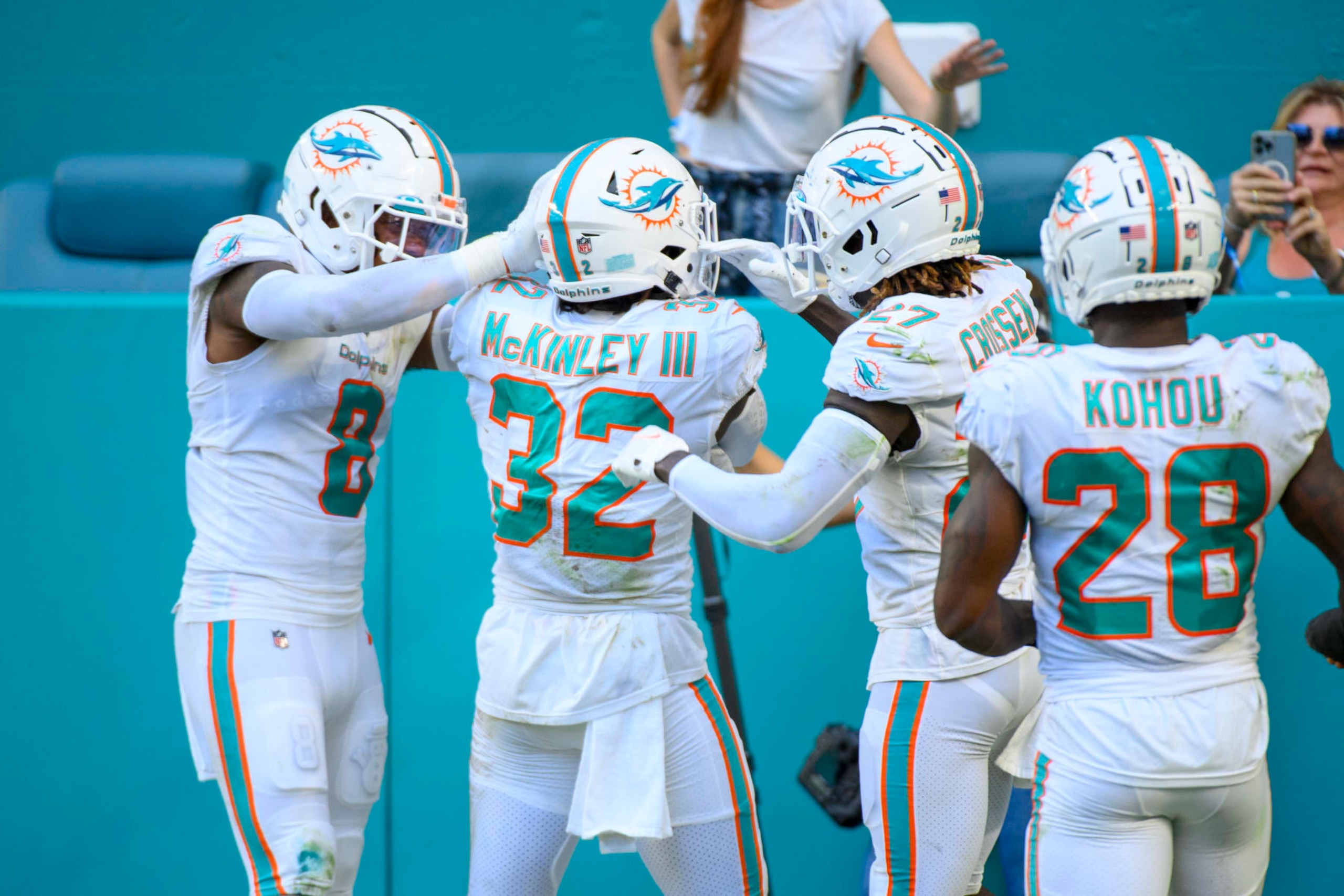 Miami Dolphins safety Verone McKinley III (32) celebrates intercepting a pass from Houston Texans quarterback Kyle Allen (not shown) with Miami Dolphins safety Jevon Holland (8), Miami Dolphins defensive back Keion Crossen (27) and Miami Dolphins cornerback Kader Kohou (28) during an NFL football game between the Houston Texans and the Miami Dolphins, Sunday, Nov. 27, 2022, in Miami Gardens, Fla. (AP Photo/Doug Murray) Miami Dolphins safety Verone McKinley III (32) celebrates intercepting a pass from Houston Texans quarterback Kyle Allen (not shown) with Miami Dolphins safety Jevon Holland (8), Miami Dolphins defensive back Keion Crossen (27) and Miami Dolphins cornerback Kader Kohou (28) during an NFL football game between the Houston Texans and the Miami Dolphins, Sunday, Nov. 27, 2022, in Miami Gardens, Fla. (AP Photo/Doug Murray)