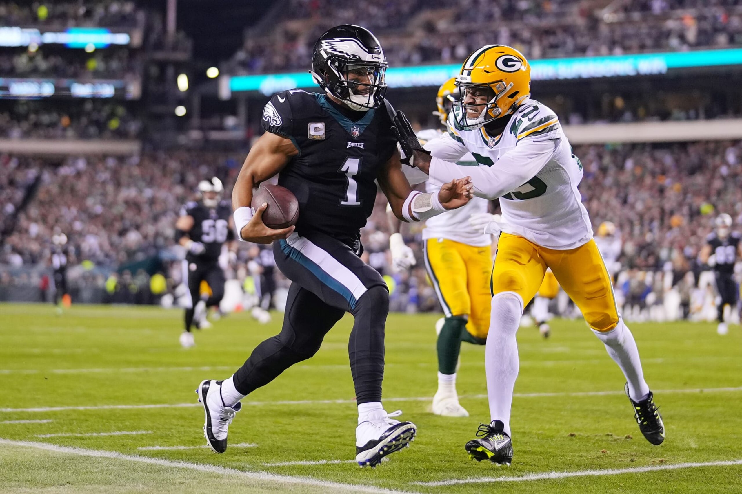 PHILADELPHIA, PENNSYLVANIA - NOVEMBER 27: Jalen Hurts #1 of the Philadelphia Eagles is pushed out of bounds by Rasul Douglas #29 of the Green Bay Packers during the first quarter at Lincoln Financial Field on November 27, 2022 in Philadelphia, Pennsylvania. (Photo by Mitchell Leff/Getty Images) PHILADELPHIA, PENNSYLVANIA - NOVEMBER 27: Jalen Hurts #1 of the Philadelphia Eagles is pushed out of bounds by Rasul Douglas #29 of the Green Bay Packers during the first quarter at Lincoln Financial Field on November 27, 2022 in Philadelphia, Pennsylvania. (Photo by Mitchell Leff/Getty Images)