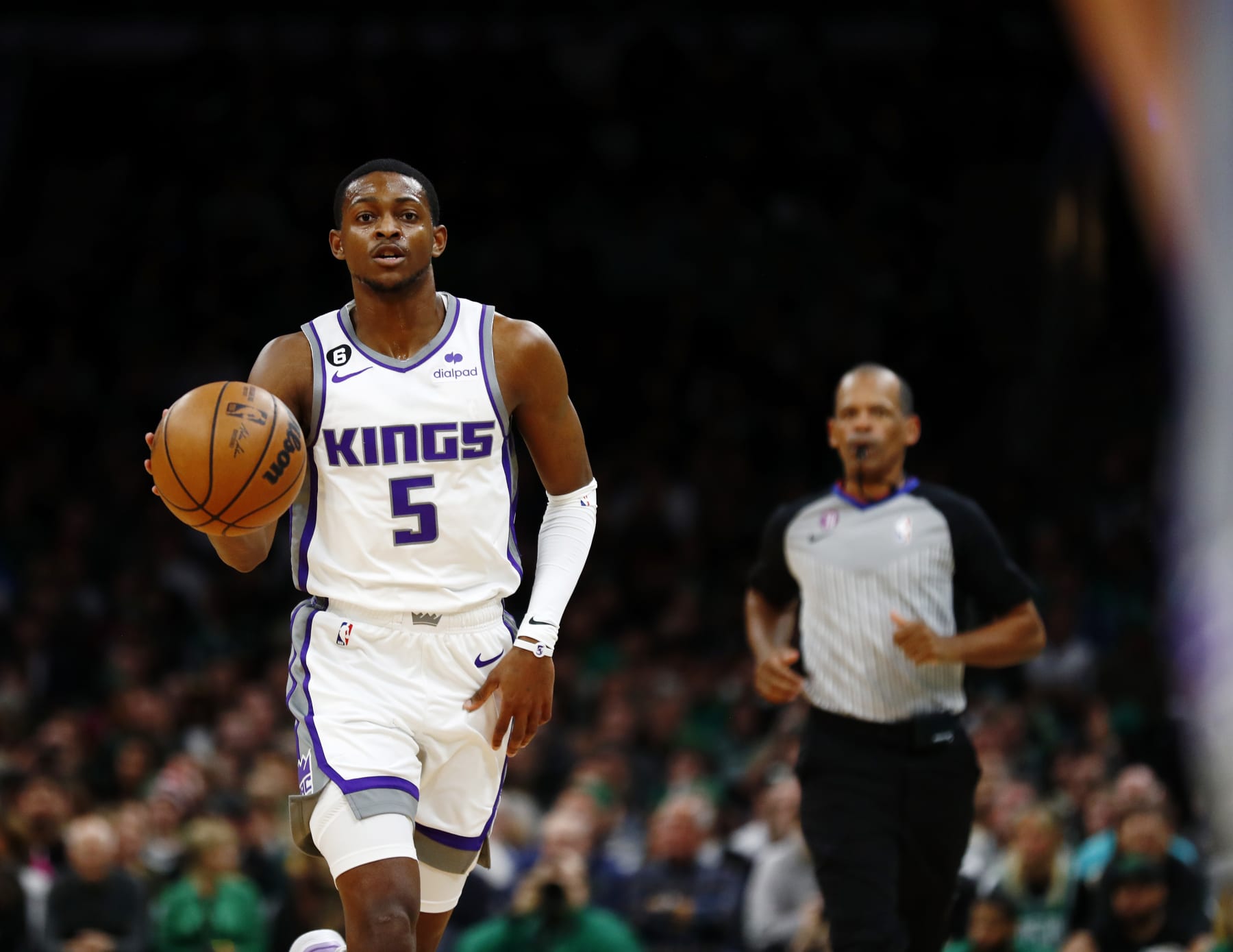 BOSTON, MASSACHUSETTS - NOVEMBER 25: De'Aaron Fox #5 of the Sacramento Kings brings the ball up court during the first quarter of the game against the Boston Celtics at TD Garden on November 25, 2022 in Boston, Massachusetts. User expressly acknowledges and agrees that, by downloading and or using this photograph, User is consenting to the terms and conditions of the Getty Images License Agreement. (Photo by Omar Rawlings/Getty Images)