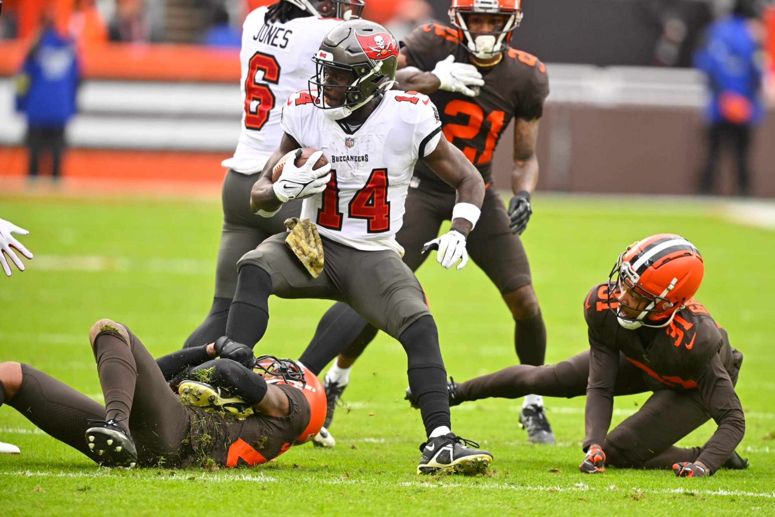 Tampa Bay Buccaneers wide receiver Chris Godwin (14) is tackled after making a catch during the first half of an NFL football game against the Cleveland Browns in Cleveland, Sunday, Nov. 27, 2022. (AP Photo/David Richard) Tampa Bay Buccaneers wide receiver Chris Godwin (14) is tackled after making a catch during the first half of an NFL football game against the Cleveland Browns in Cleveland, Sunday, Nov. 27, 2022. (AP Photo/David Richard)