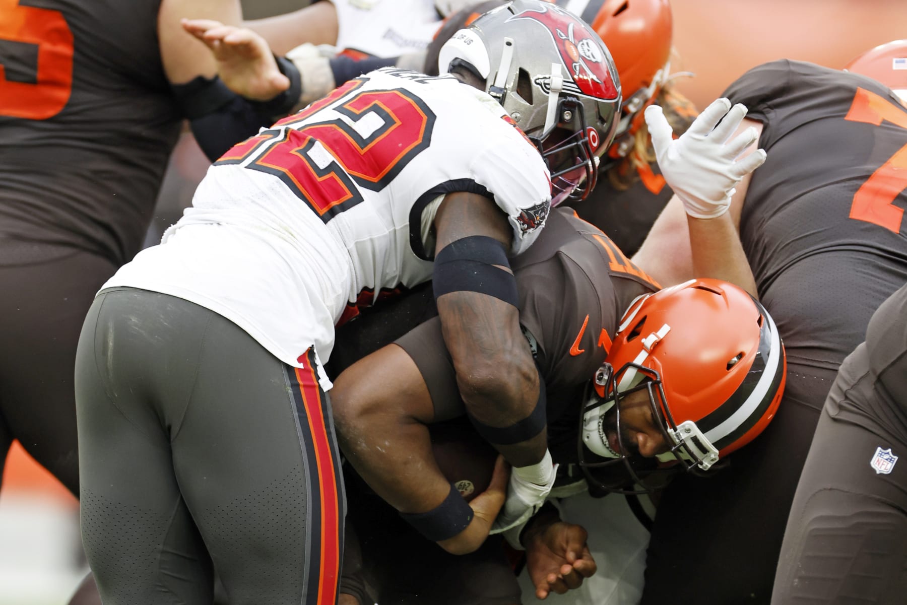 Tampa Bay Buccaneers safety Keanu Neal (22) sacks Cleveland Browns quarterback Jacoby Brissett (7) during the second half of an NFL football game in Cleveland, Sunday, Nov. 27, 2022. (AP Photo/Ron Schwane)