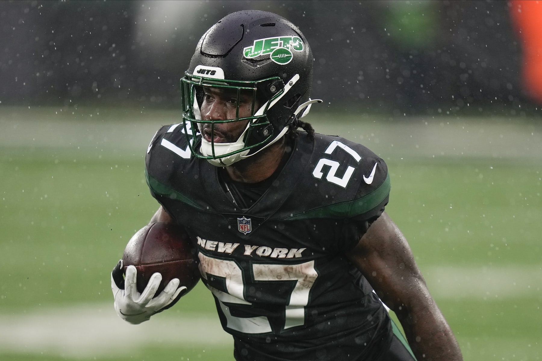 New York Jets running back Zonovan Knight (27) carries the ball against the Chicago Bears during the third quarter of an NFL football game, Sunday, Nov. 27, 2022, in East Rutherford, N.J. (AP Photo/Seth Wenig)