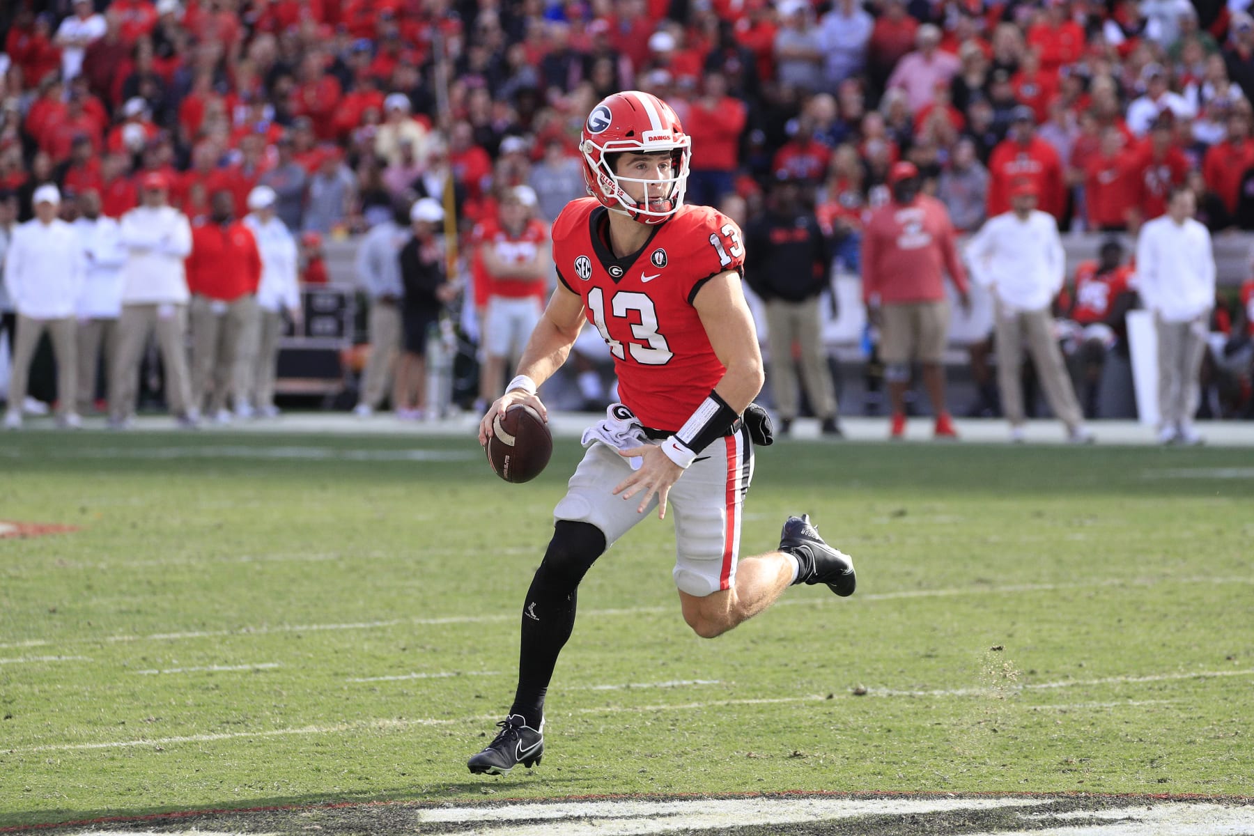 ATHENS, GA - NOVEMBER 26: Georgia Bulldogs starting quarterback Stetson Bennett (13) scrambles during the second half of the Saturday afternoon college football game between the University of Georgia Bulldogs and the Georgia Tech Yellow Jackets on November 26, 2022 at Sanford Stadium in Athens, GA.  (Photo by David J. Griffin/Icon Sportswire via Getty Images)