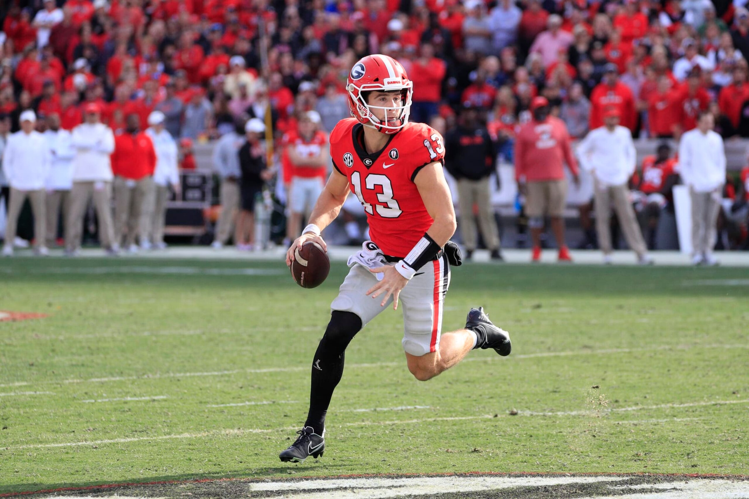 ATHENS, GA - NOVEMBER 26: Georgia Bulldogs starting quarterback Stetson Bennett (13) scrambles during the second half of the Saturday afternoon college football game between the University of Georgia Bulldogs and the Georgia Tech Yellow Jackets on November 26, 2022 at Sanford Stadium in Athens, GA. (Photo by David J. Griffin/Icon Sportswire via Getty Images) ATHENS, GA - NOVEMBER 26: Georgia Bulldogs starting quarterback Stetson Bennett (13) scrambles during the second half of the Saturday afternoon college football game between the University of Georgia Bulldogs and the Georgia Tech Yellow Jackets on November 26, 2022 at Sanford Stadium in Athens, GA. (Photo by David J. Griffin/Icon Sportswire via Getty Images)