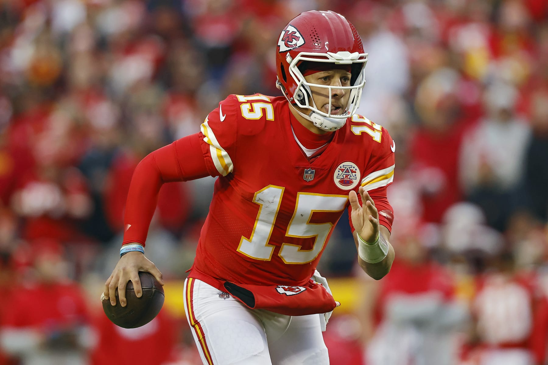 KANSAS CITY, MISSOURI - NOVEMBER 27: Patrick Mahomes #15 of the Kansas City Chiefs runs with the ball during the first half against the Los Angeles Rams at Arrowhead Stadium on November 27, 2022 in Kansas City, Missouri. (Photo by David Eulitt/Getty Images)