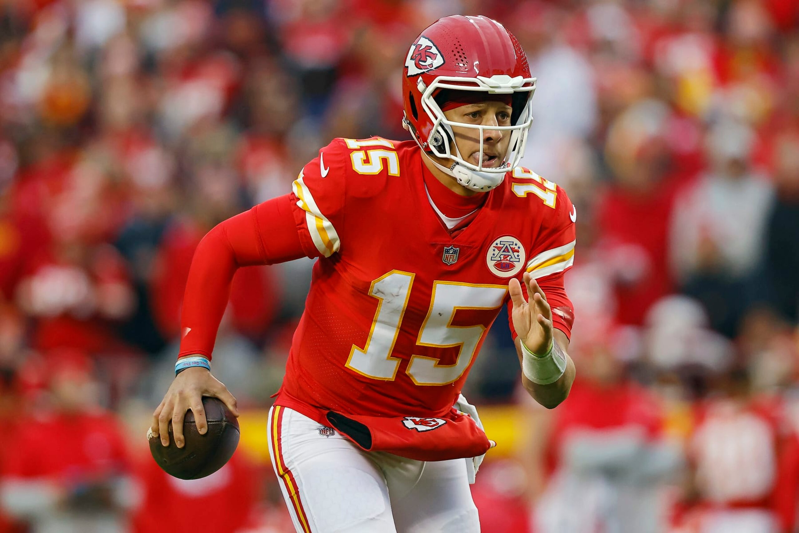 KANSAS CITY, MISSOURI - NOVEMBER 27: Patrick Mahomes #15 of the Kansas City Chiefs runs with the ball during the first half against the Los Angeles Rams at Arrowhead Stadium on November 27, 2022 in Kansas City, Missouri. (Photo by David Eulitt/Getty Images)