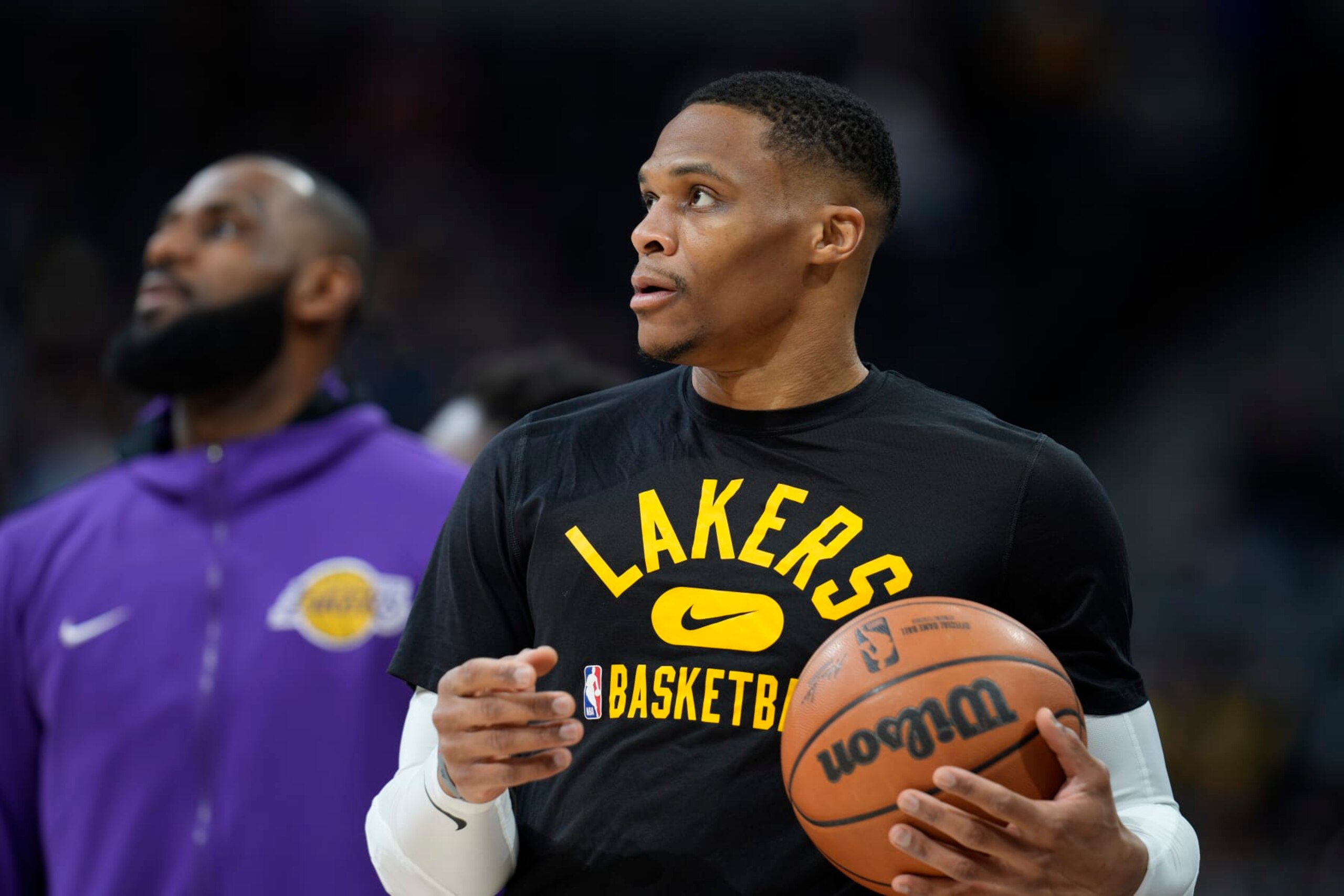 Los Angeles Lakers guard Russell Westbrook (0) and Los Angeles Lakers forward LeBron James (6) in the first half of an NBA basketball game Saturday Jan. 15, 202, in Denver. (AP Photo/David Zalubowski)