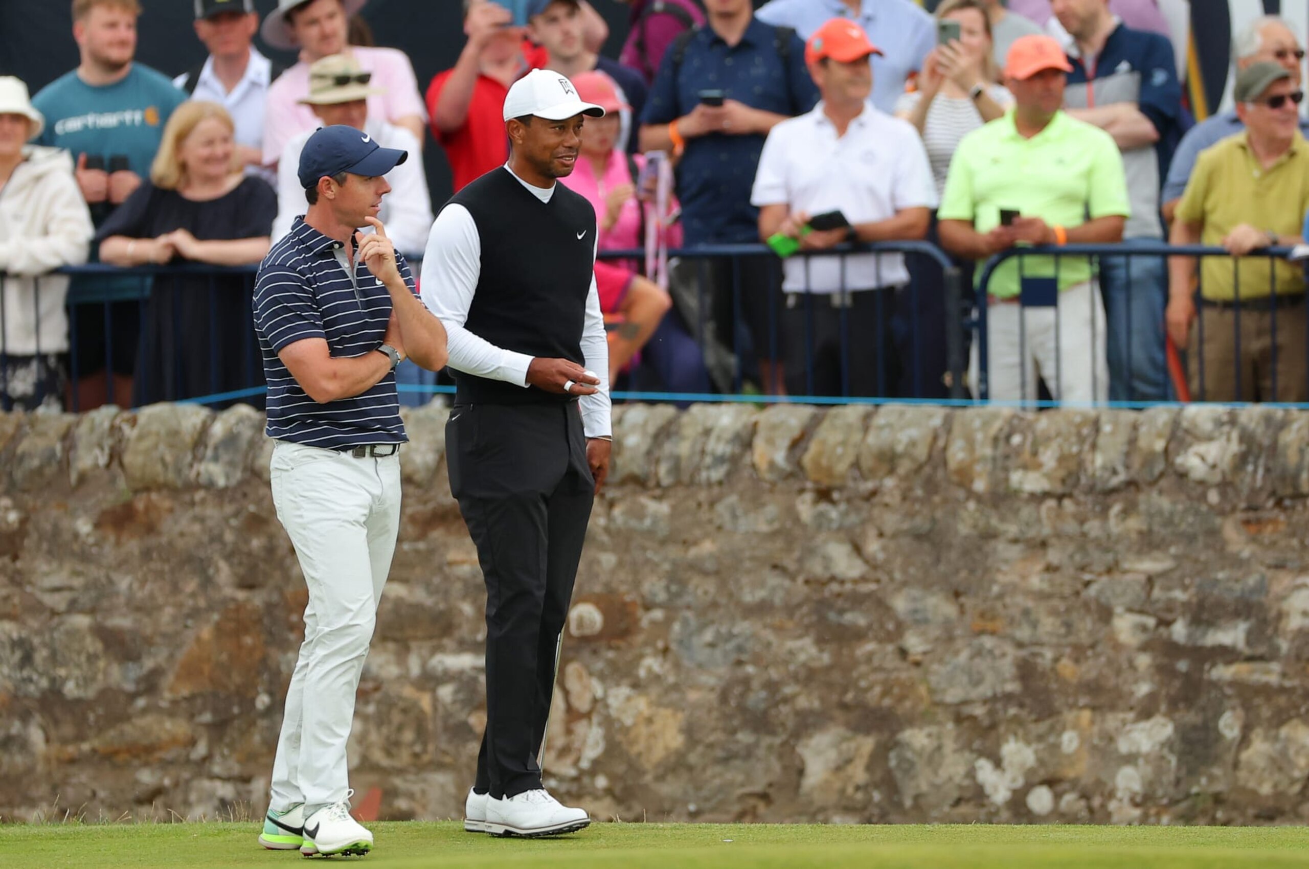 ST ANDREWS, SCOTLAND - JULY 11: Tiger Woods of The United States and Rory McIlroy of Northern Ireland interact on the 17th during the Celebration of Champions Challenge during a practice round prior to The 150th Open at St Andrews Old Course on July 11, 2022 in St Andrews, Scotland. (Photo by Kevin C. Cox/Getty Images) ST ANDREWS, SCOTLAND - JULY 11: Tiger Woods of The United States and Rory McIlroy of Northern Ireland interact on the 17th during the Celebration of Champions Challenge during a practice round prior to The 150th Open at St Andrews Old Course on July 11, 2022 in St Andrews, Scotland. (Photo by Kevin C. Cox/Getty Images)